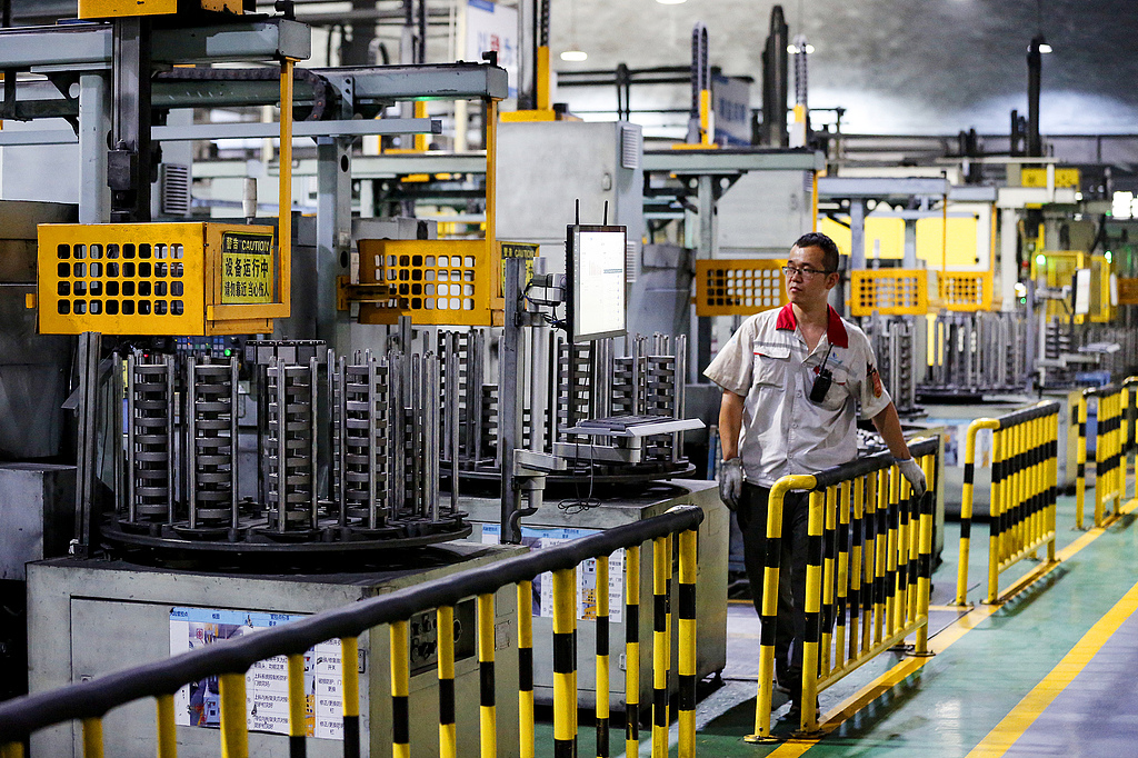 Workers on auto lines at Huaxiang cylinder factory in Linfen, Shanxi Province, July 11, 2026. /VCG