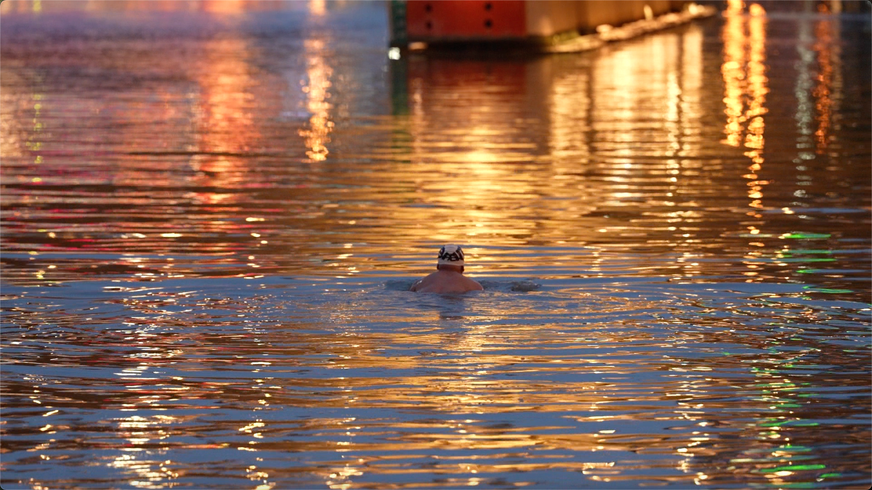 An elderly man swims in the Haihe River, in Tianjin, northern China on July 9, 2026. /CGTN