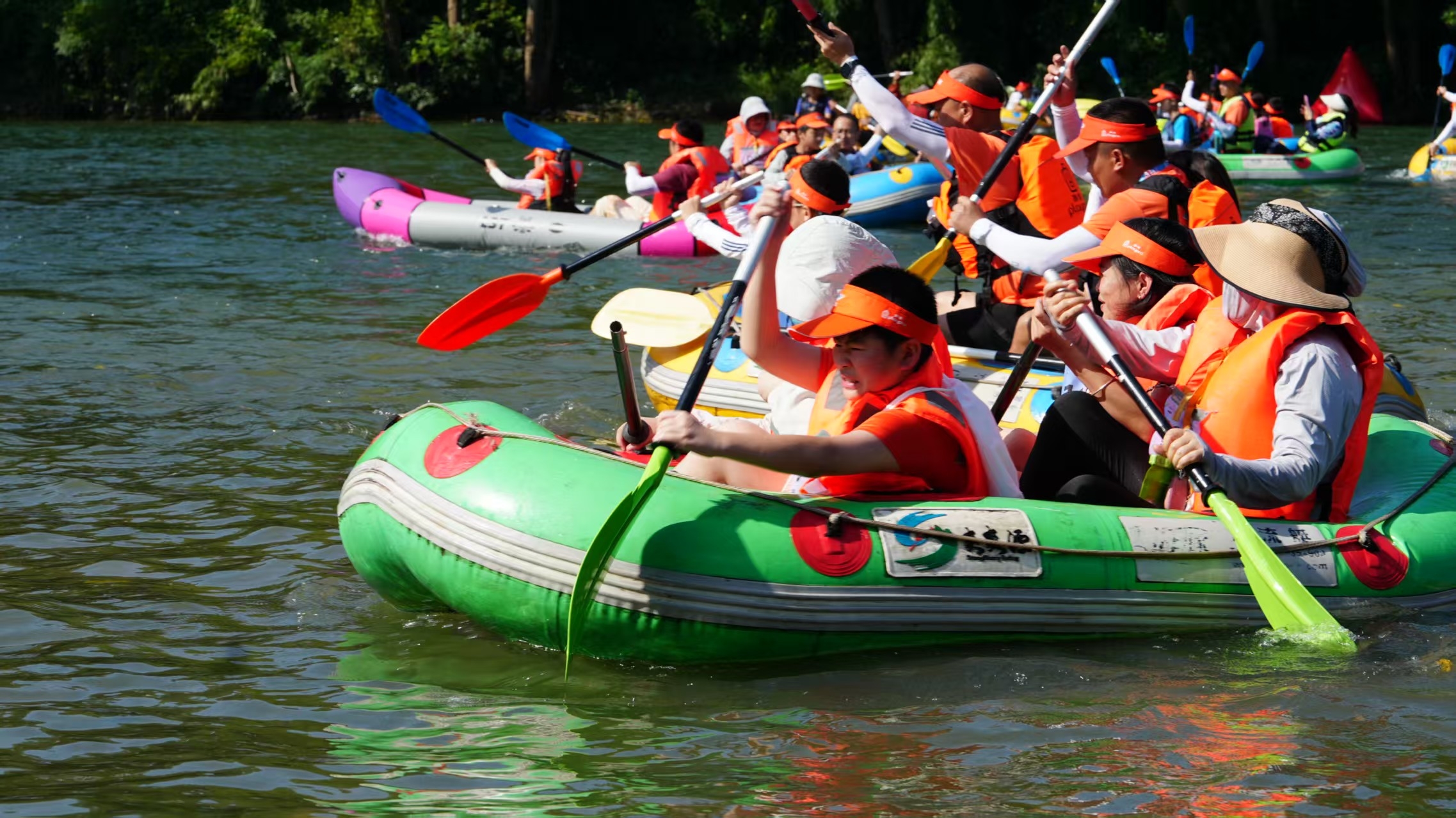 People attend a kayak race in Tongren, southwest China's Guizhou Province on July 12, 2026. /Tongren Media Convergence Center