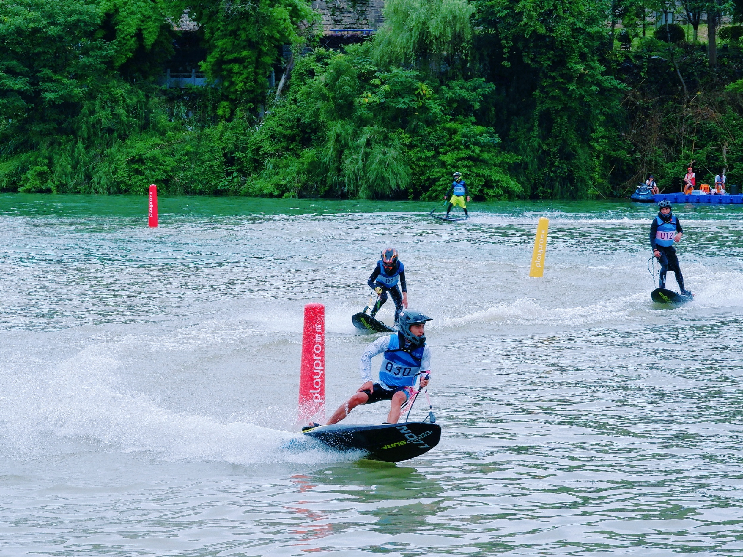 People attend an electric power surfboard race in Tongren, southwest China's Guizhou Province on July 5, 2026. /Tongren Media Convergence Center