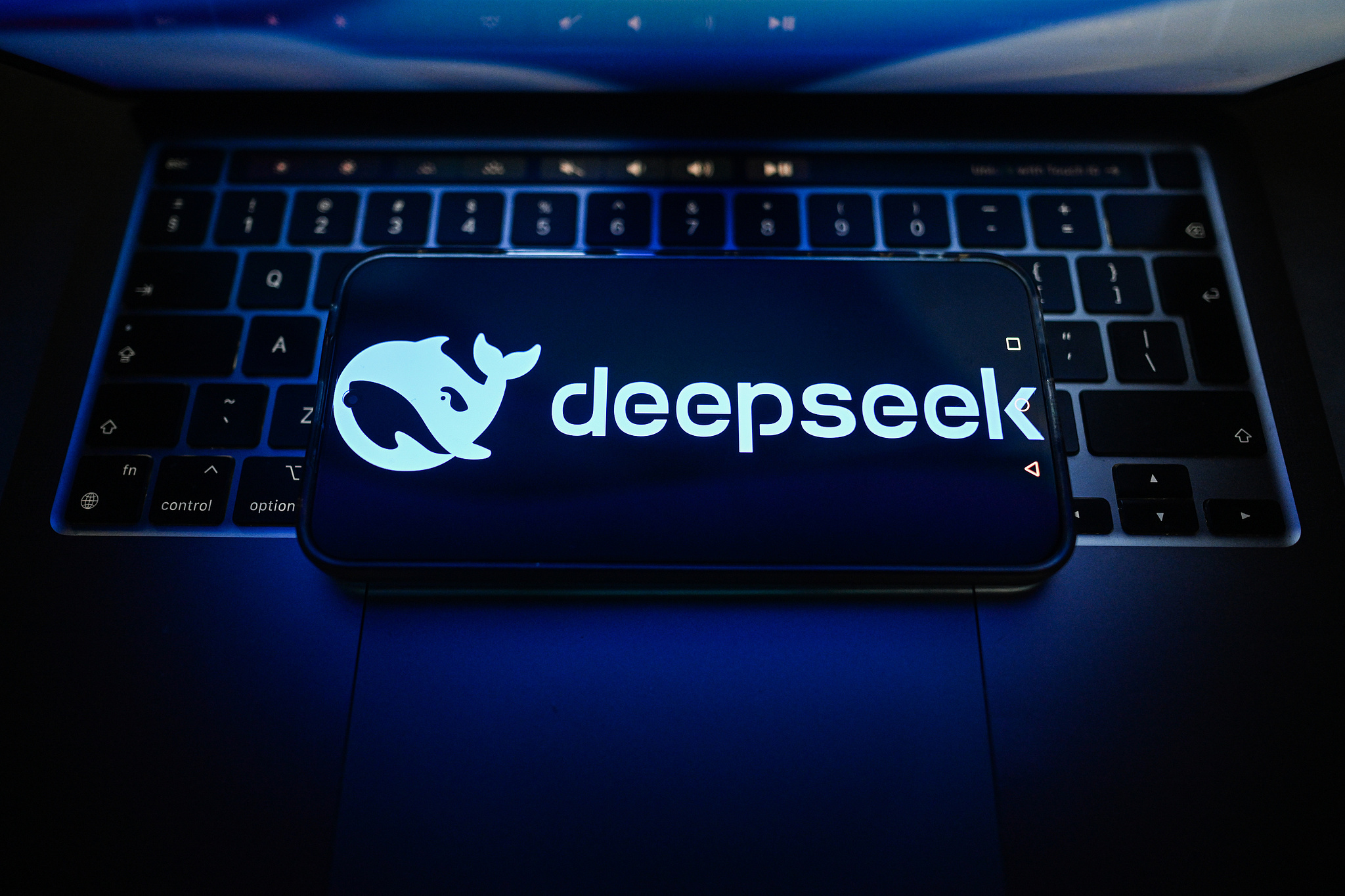 A DeepSeek logo is seen on a smartphone lying on a laptop, July 15, 2026. /CFP