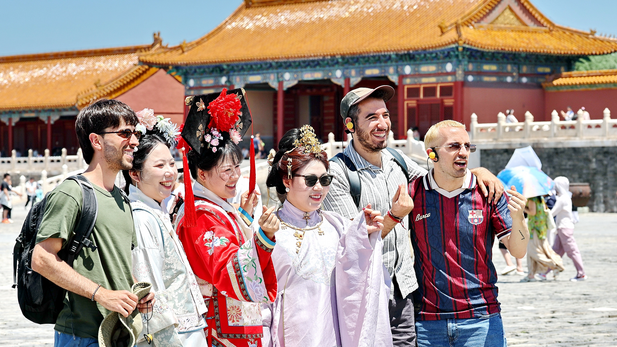 Tourists take a photo at the Palace Museum in Beijing, capital of China, June 21, 2026. /VCG
