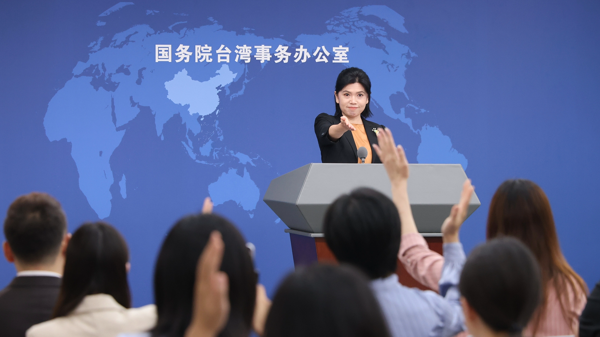A file photo of Zhu Fenglian, spokesperson for the State Council Taiwan Affairs Office, answering questions at a regular press conference in Beijing, China. /VCG