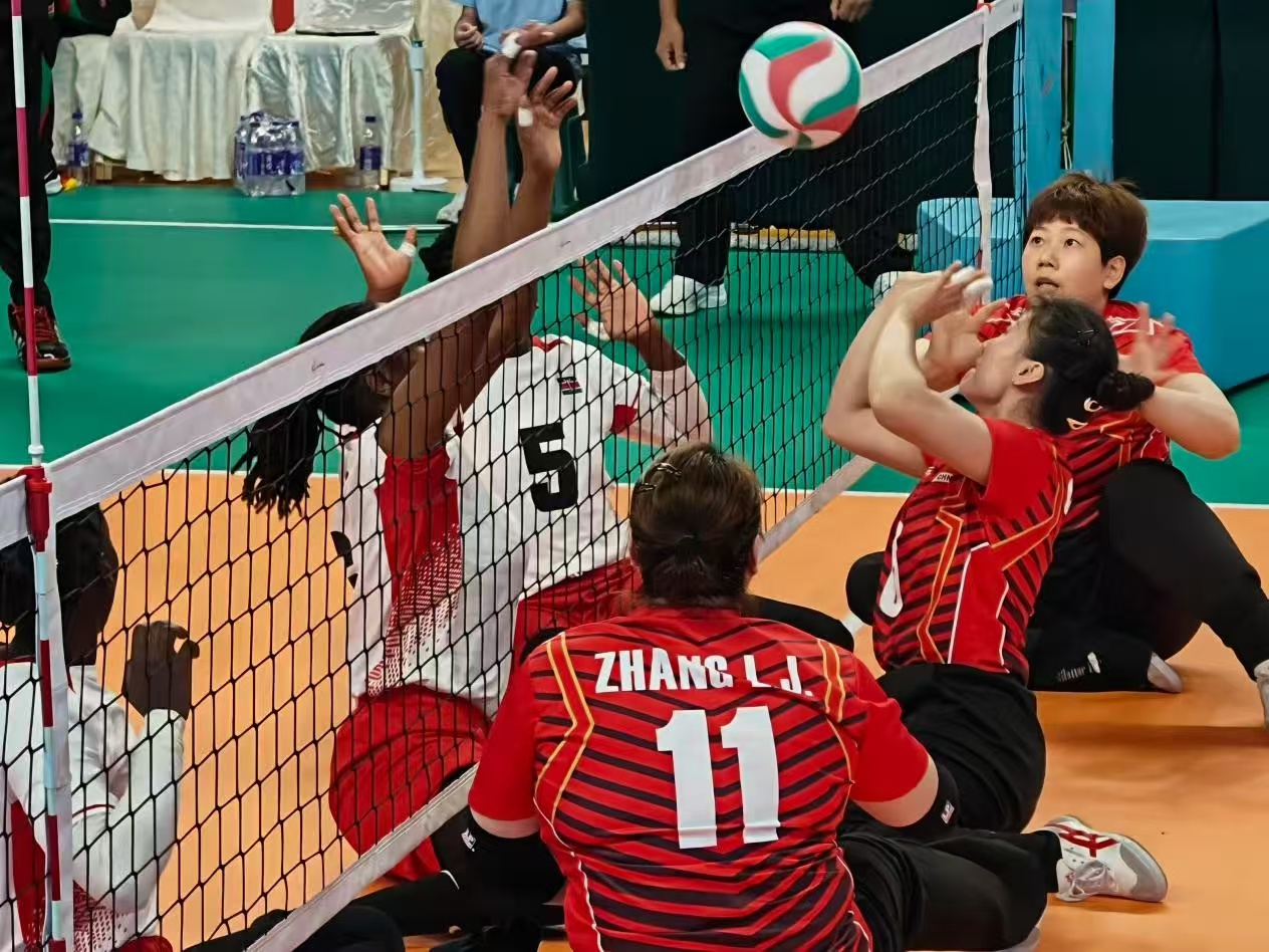 Sitting volleyball players compete with their hips in contact with the floor at the China Goalball Training Base in Hangzhou, Zhejiang Province. /Luo Xiao, CMG