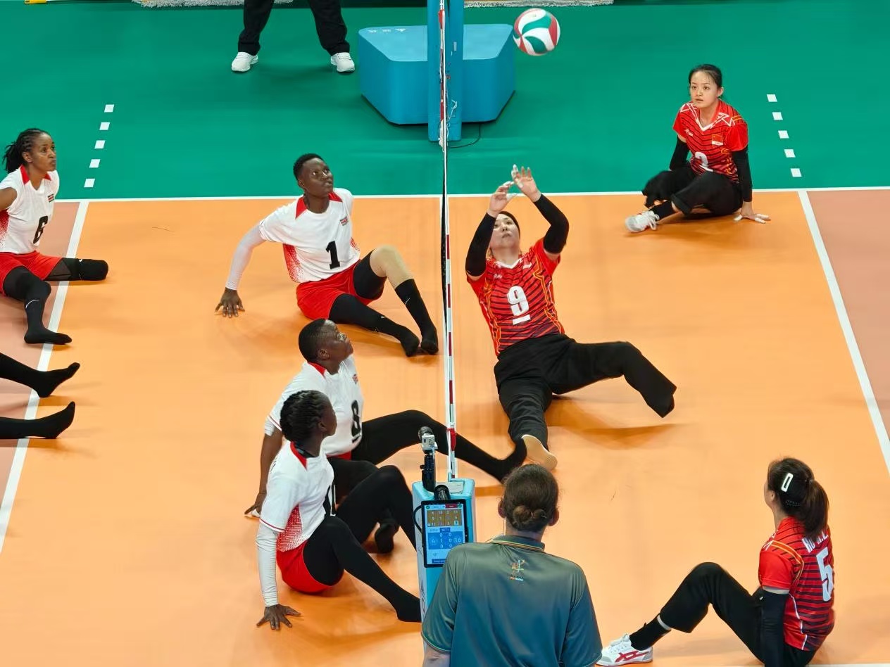 Players propel themselves using their hands, hips and legs during a sitting volleyball match at the China Goalball Training Base in Hangzhou, Zhejiang Province. /Luo Xiao, CMG