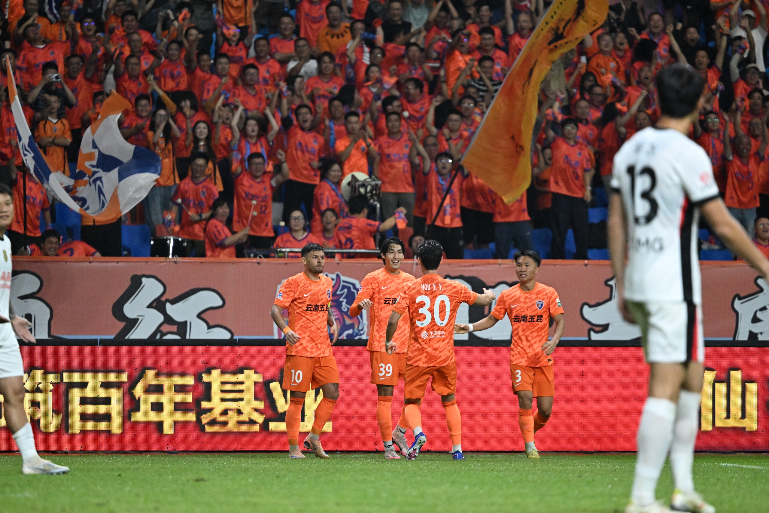 Yunnan Yukun players celebrate after scoring a goal in the Chinese Super League match against Shanghai Port in Yuxi, southwest China's Yunnan Province, July 17, 2026. /IC Photo