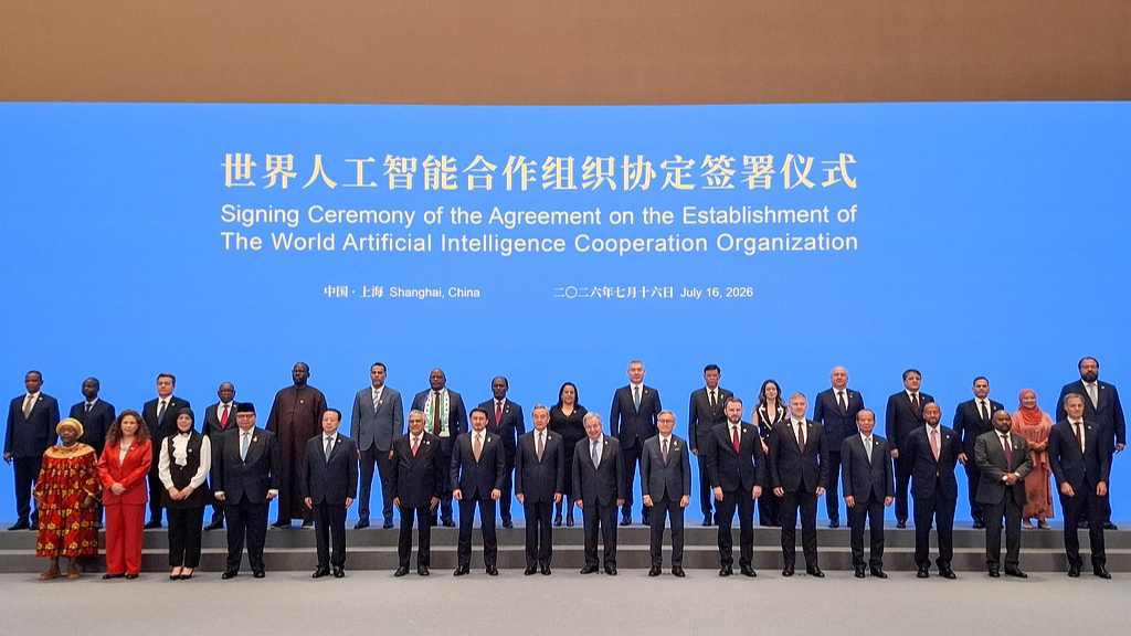 Officials pose for a group photo during a ceremony to sign an agreement on establishing the World AI Cooperation Organization in Shanghai, China, July 16, 2026. /VCG
