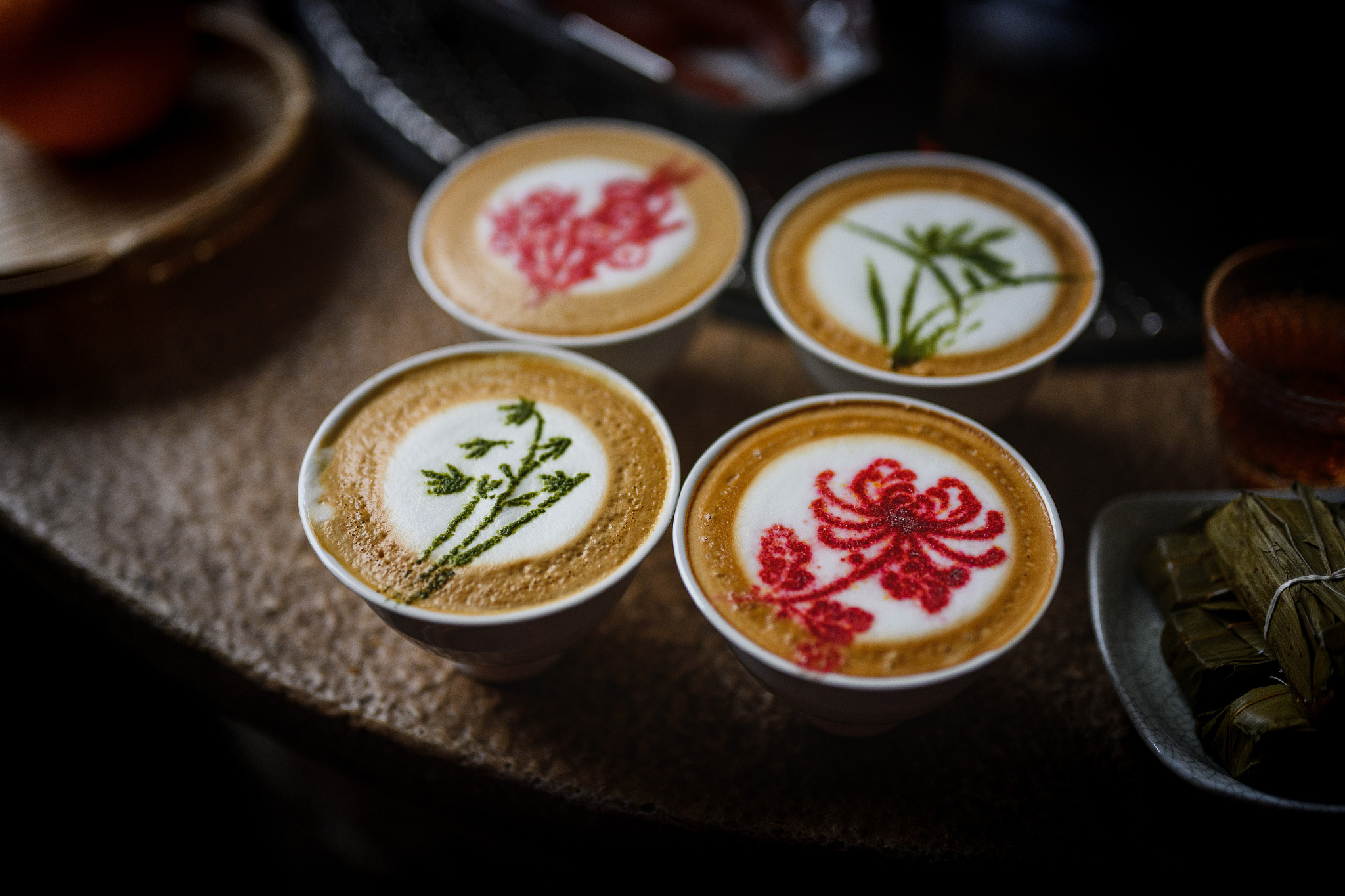 A stock photo of latte art with plum blossom, orchid, bamboo and chrysanthemum. /VCG