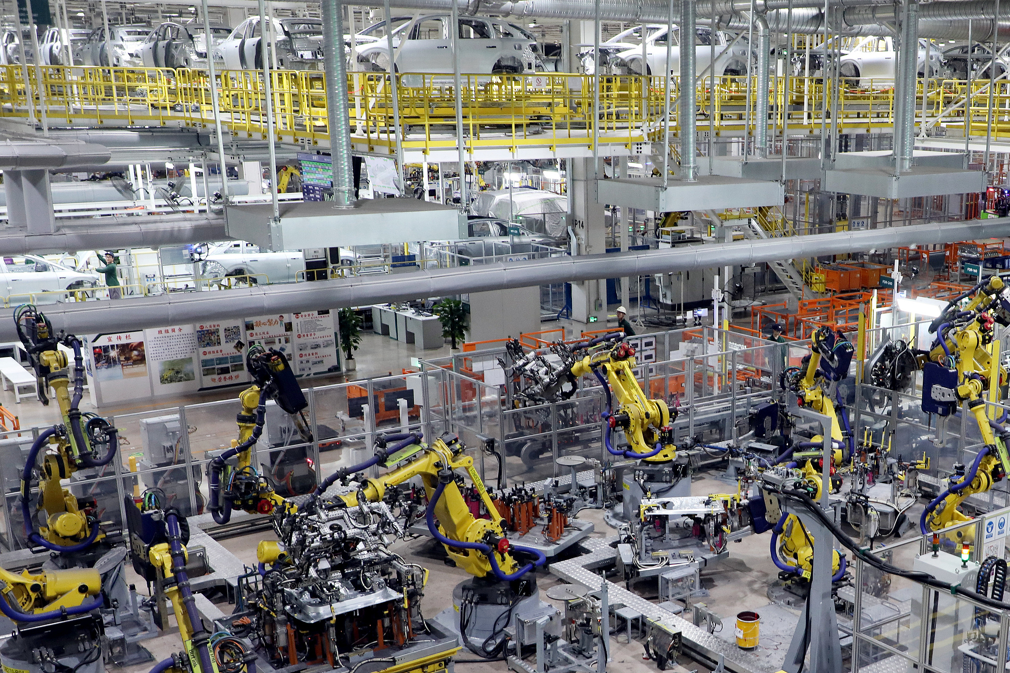 Robots assemble automotive components on the production line at a manufacturing base in Changzhou, Jiangsu Province, China, July 16, 2026. /VCG