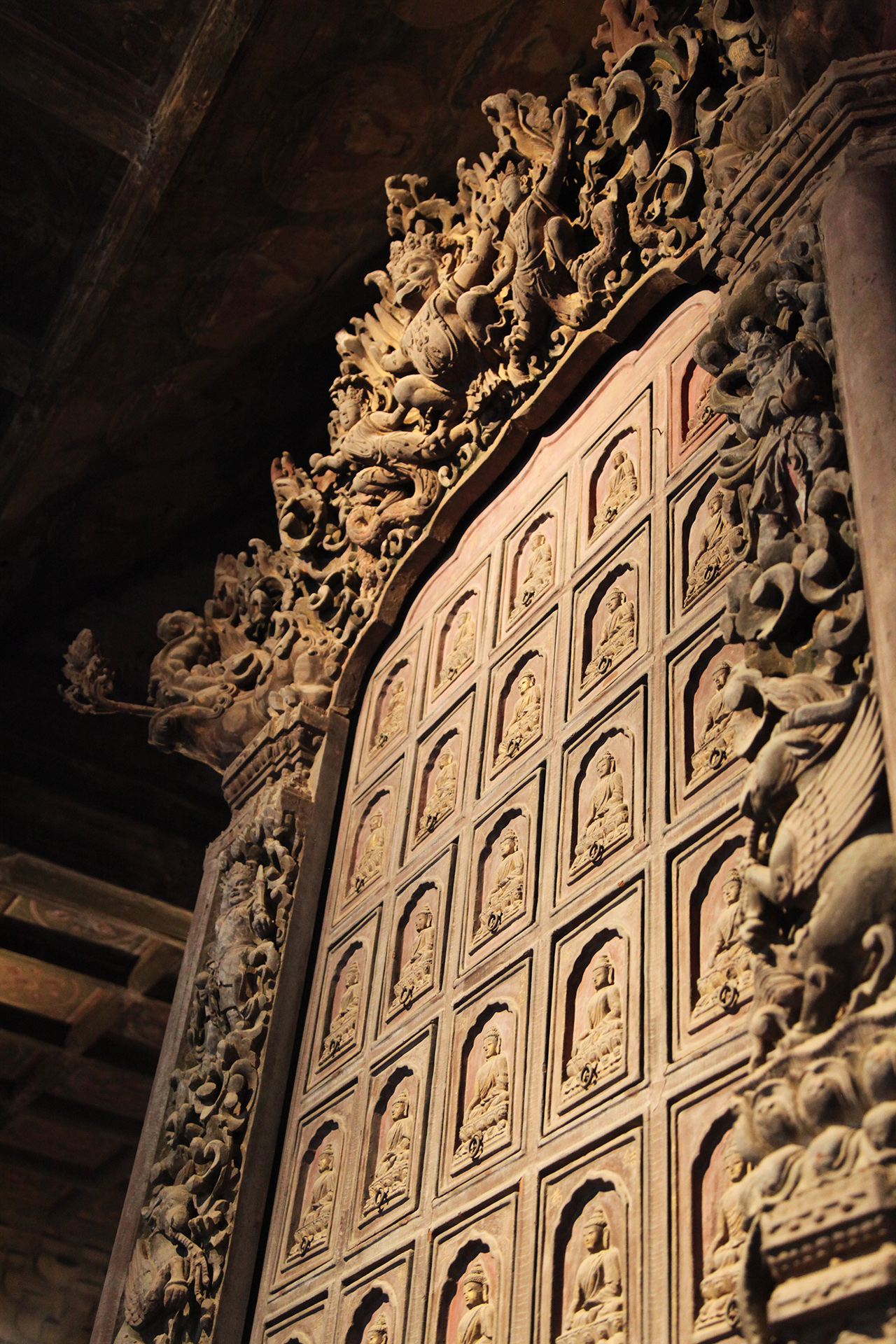 The sutra cabinet at Beijing's Zhihua Temple contains 360 drawers for storing Buddhist scriptures and is decorated with intricate carvings. /CGTN