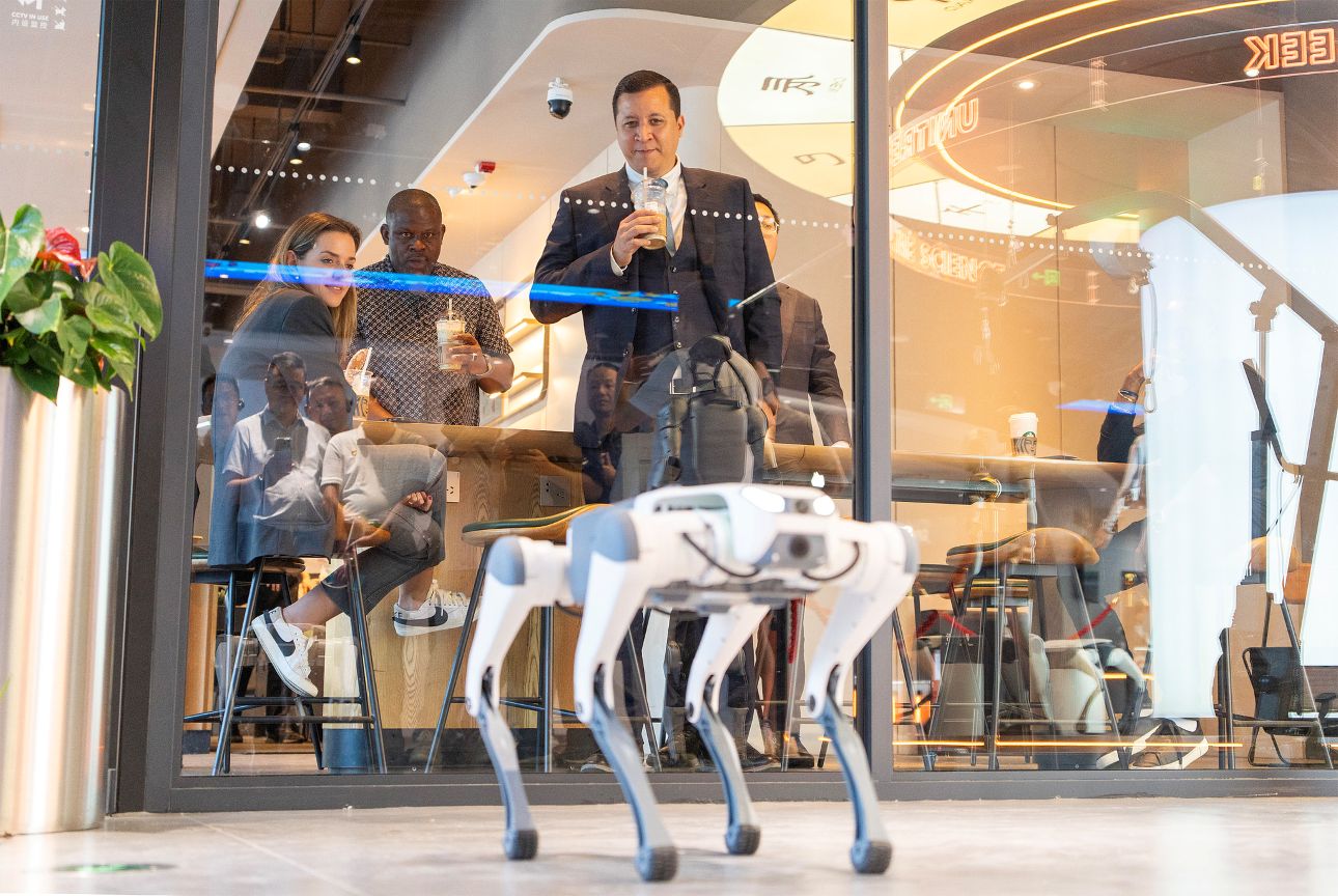 People watch a quadruped robot walk at the Wensan Future Technology Experience Center in Hangzhou, Zhejiang Province, east China, September 16, 2025. /CFP