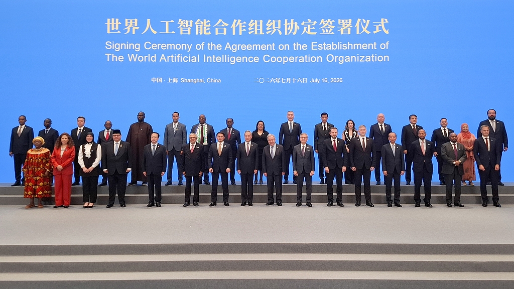 Officials pose for a group photo during a ceremony to sign an agreement on establishing the World AI Cooperation Organization, July 16, 2026. /VCG