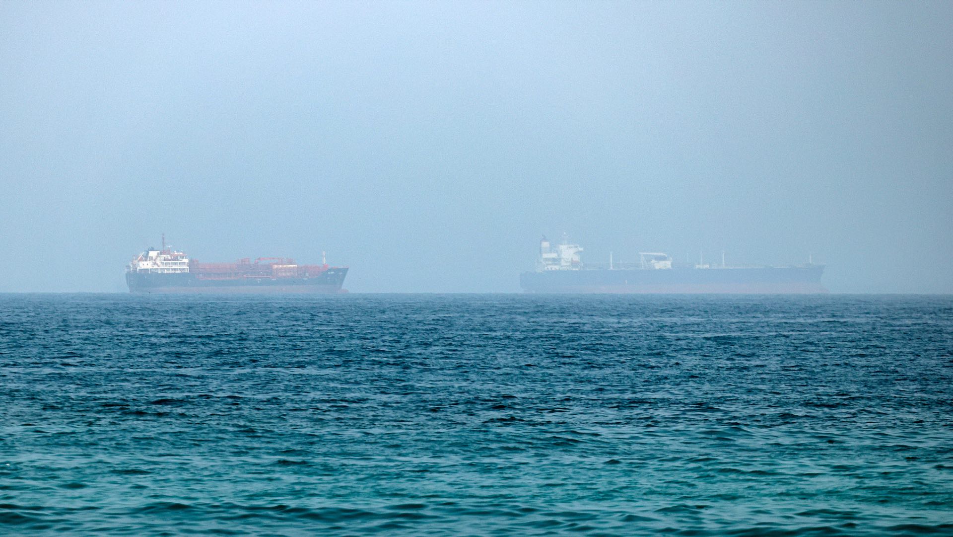 Cargo vessels are seen at one end of the Strait of Hormuz near the coast of Dibba Al Fujairah, United Arab Emirates, July 21, 2026. /VCG