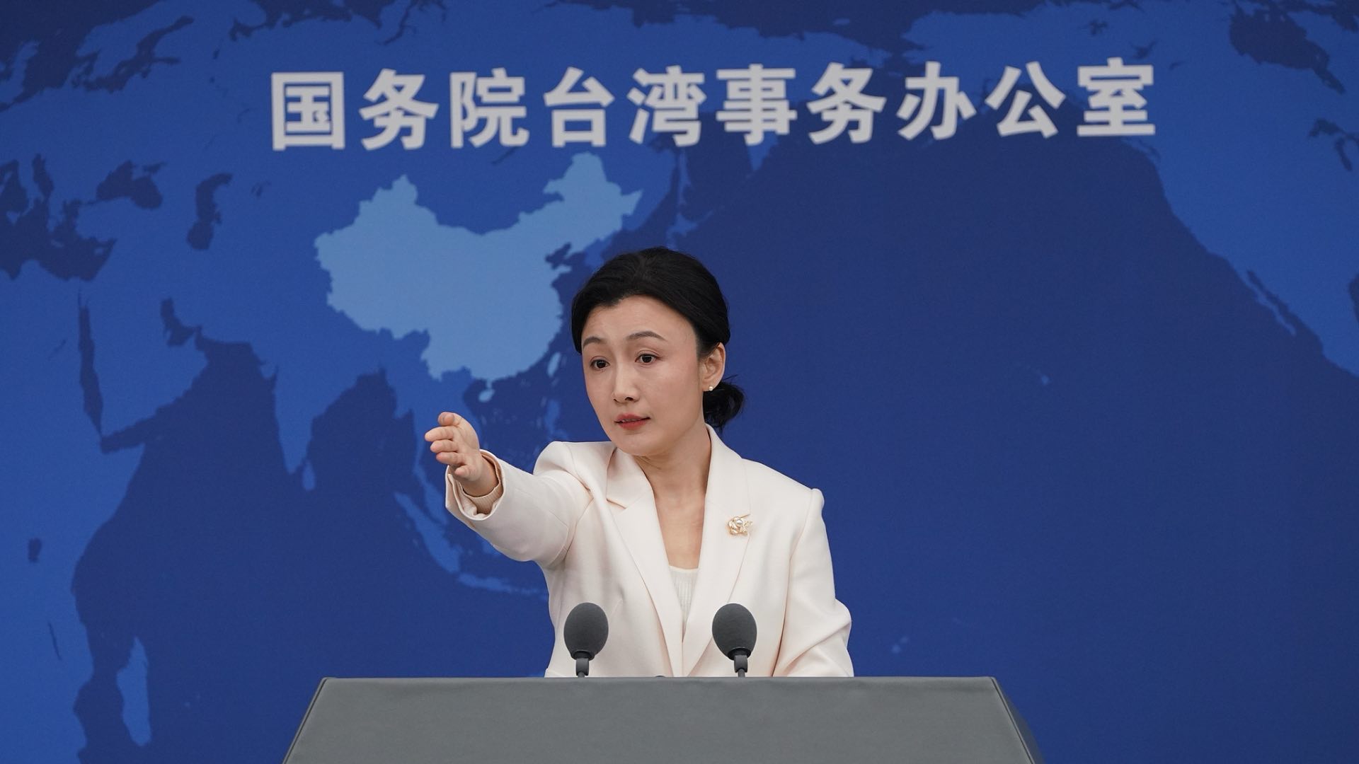 A file photo of Zhang Han, spokesperson for the State Council Taiwan Affairs Office, answering questions at a regular press conference in Beijing, China. /VCG