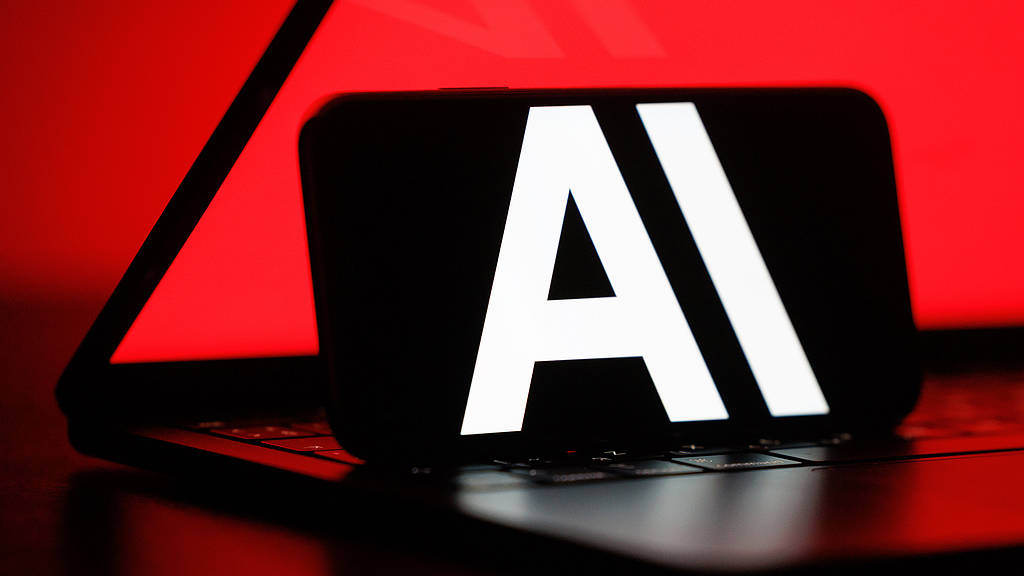 An AI symbol on a smartphone. /VCG