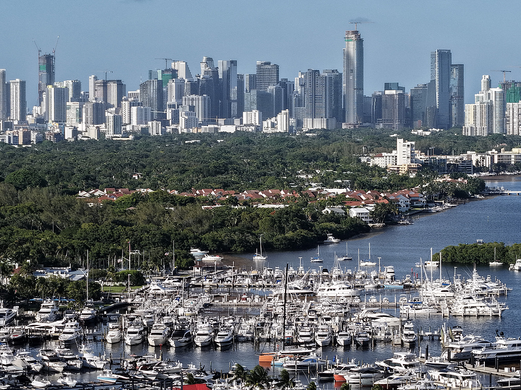 In an aerial view, boats are docked at Dinner Key Marina as the city skyline is seen in the background on July 21, 2026 in Miami, Florida. /VCG