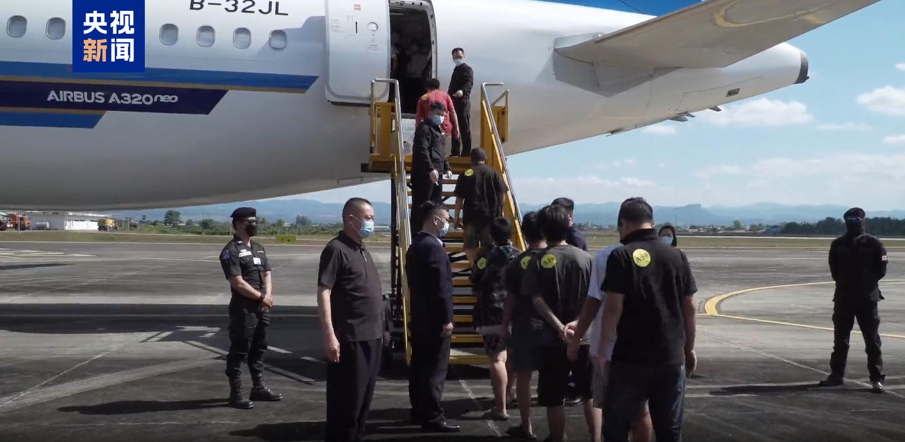 Suspects are escorted back to China, following a joint China-Myanmar-Thailand operation on striking gambling and telecom fraud zones in Myanmar's Myawaddy region in December 2025, with 952 individuals extradited. /CMG