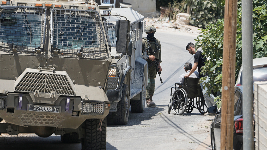 Israeli soldiers interrogate Palestinian residents during an army operation in the West Bank village of Tell, near Nablus, July 25, 2026. /VCG
