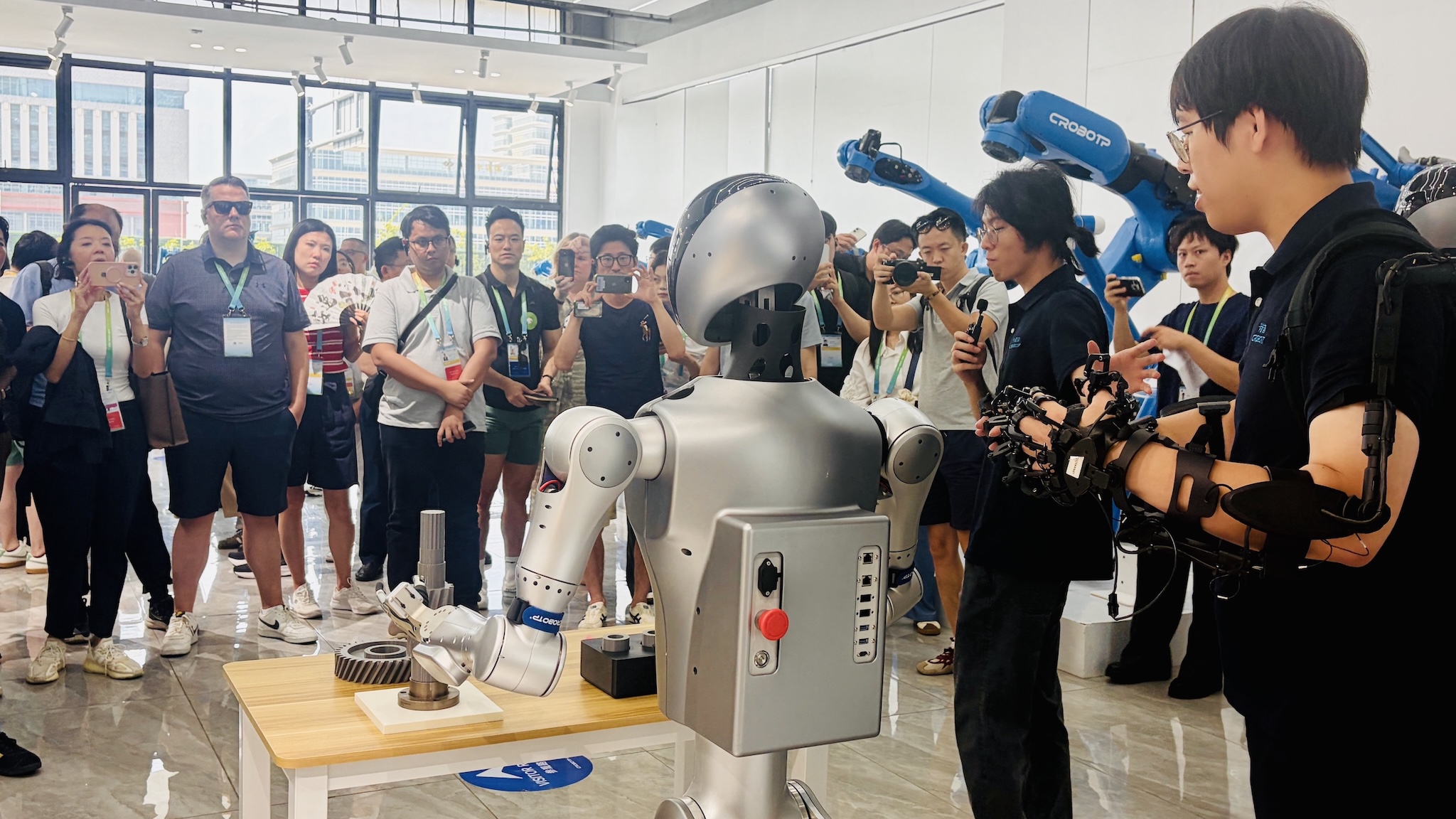 A photo of delegates from APEC economies visiting a leading Chinese industrial robotics company in Chengdu, China, on July 26, 2026./CGTN