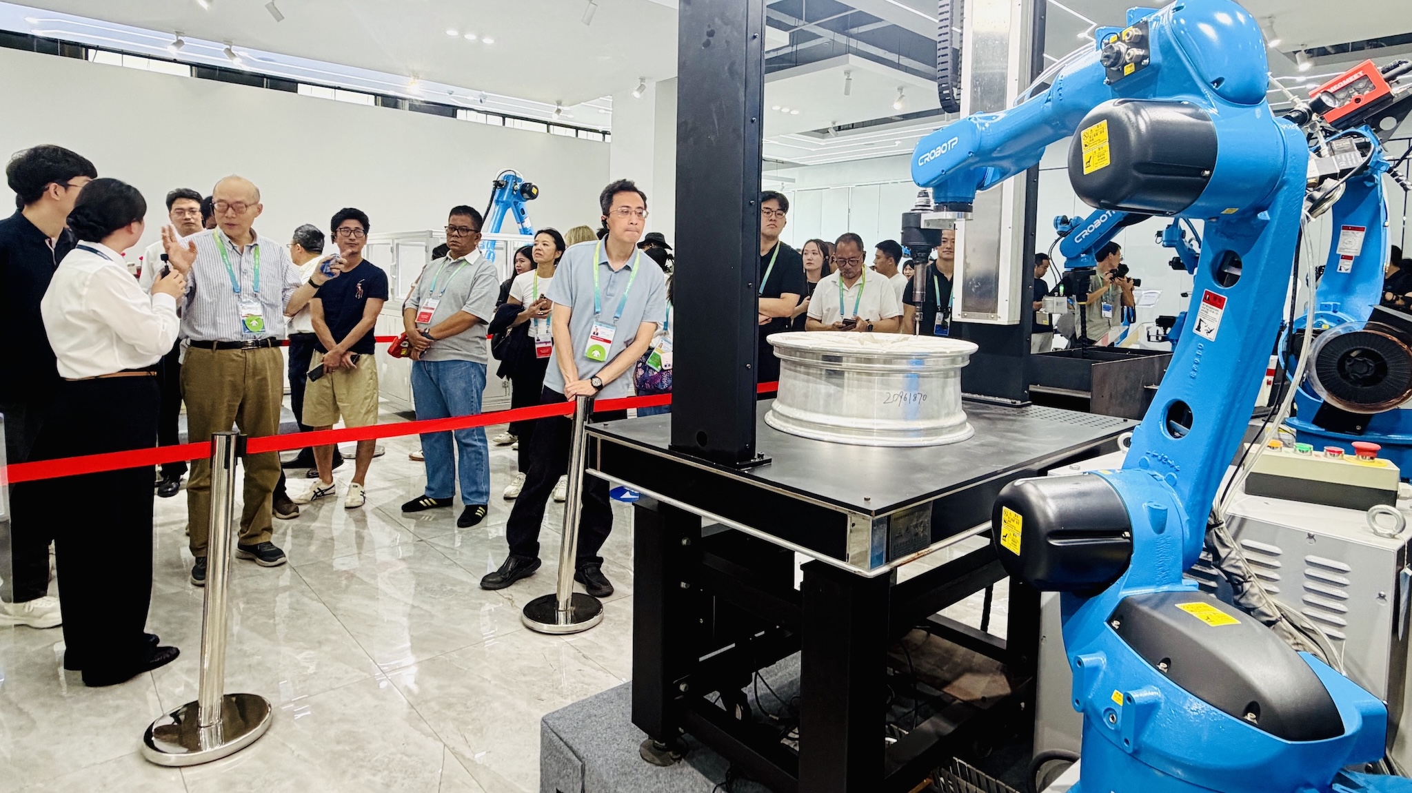 A photo of delegates from APEC economies visiting a leading Chinese industrial robotics company in Chengdu, China, on July 26, 2026./CGTN