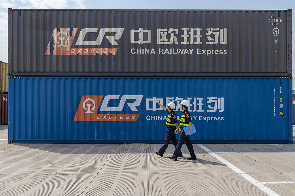 Customs officers inspect containers on a China-Europe freight train at the East China International Intermodal Port in Jinhua City, Zhejiang Province in east China, September 30, 2025. /CFP