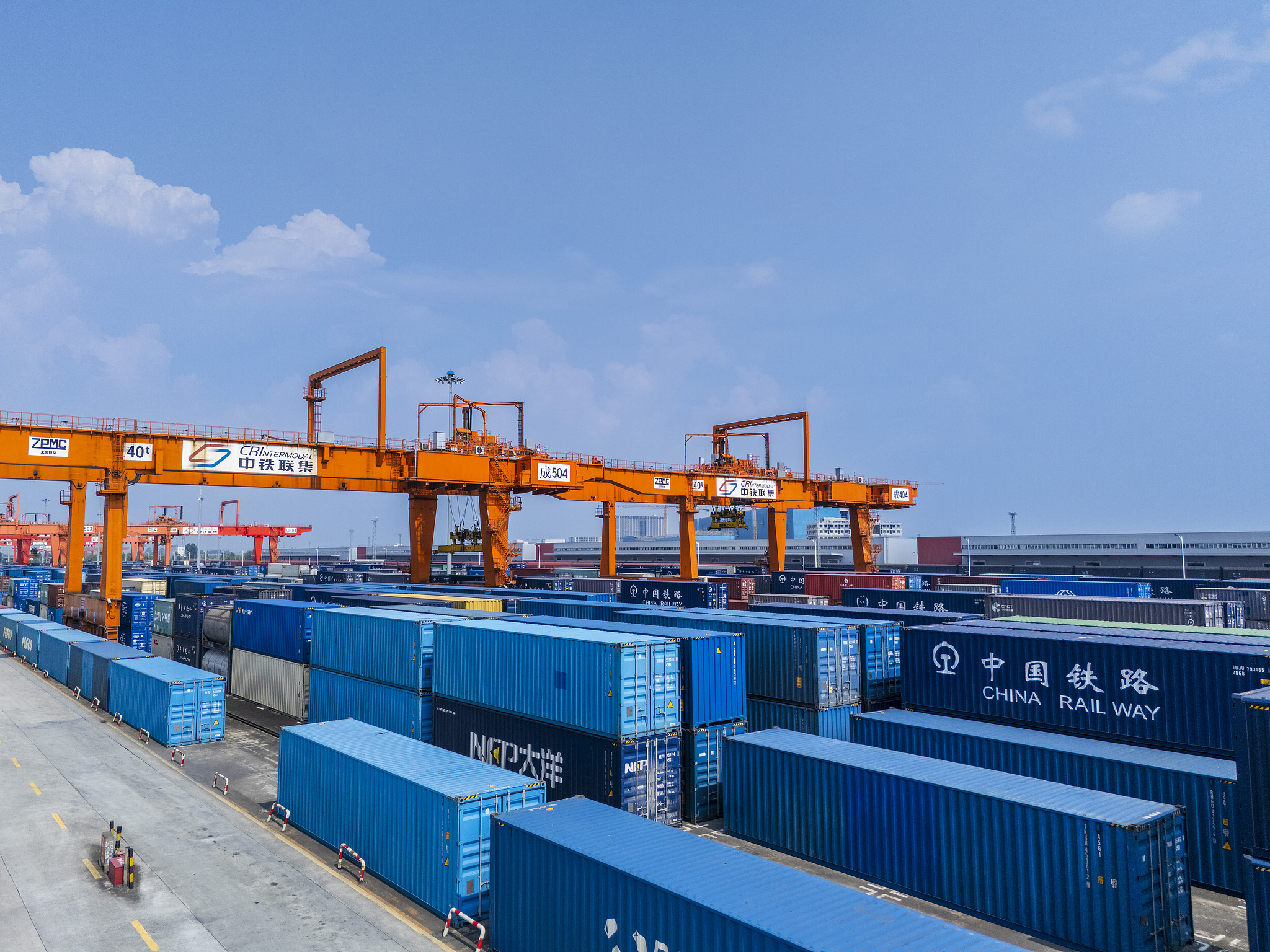 A gantry crane handles containers at a logistics center for the China Railway Express service, Chengdu, southwest China's Sichuan Province, July 7, 2026. /VCG