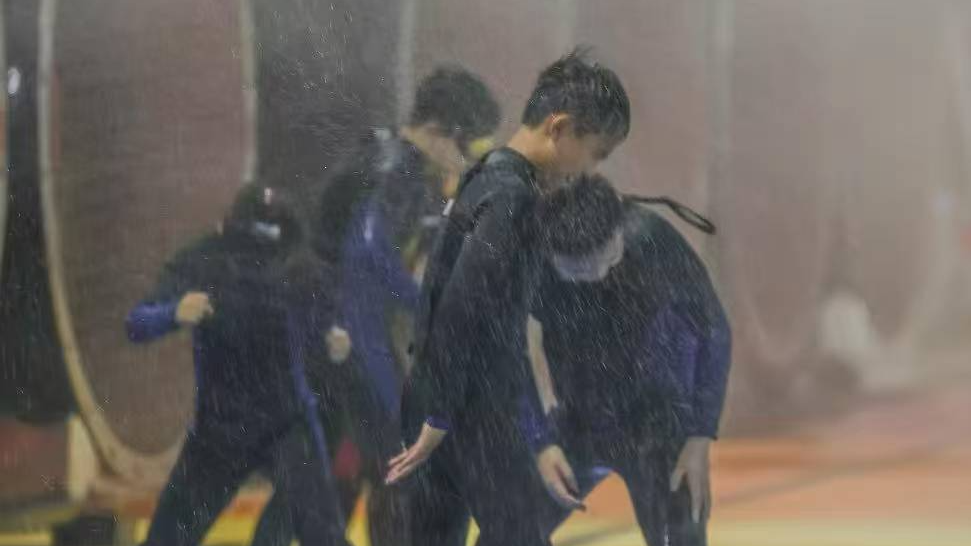 Young participants, the center's largest customer group, experience a simulated typhoon with artificial wind and rain at the Lvxing Disaster Simulation Training Center in Hangzhou, eastern China. Photo courtesy of BORO Youth Activities Club.
