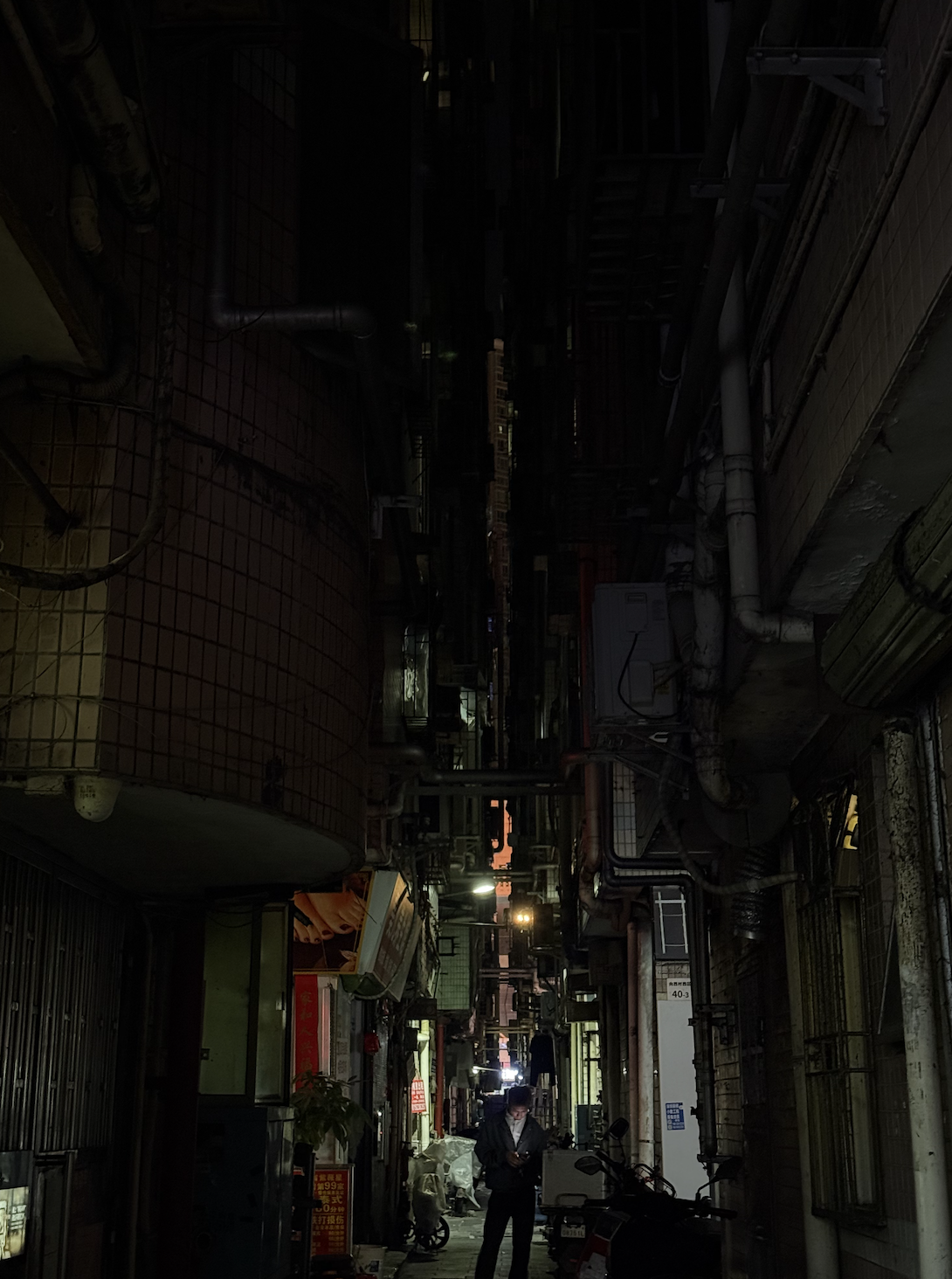 A look into the dark narrow lanes of Xiangxicun at night.
