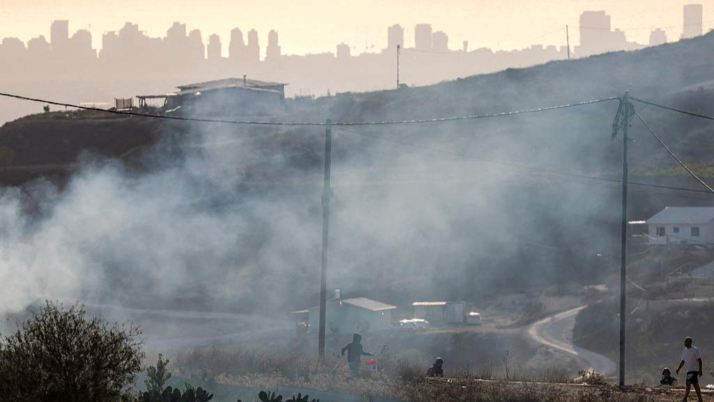 Tear gas fired by Israeli forces during clashes between Israeli settlers and Palestinians in the West Bank, July 25, 2026. /VCG