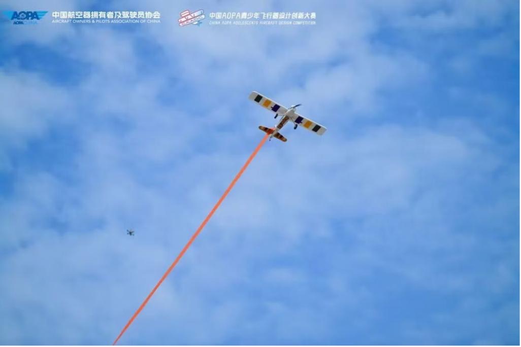 An aircraft designed and built by young people soars across the sky at an aircraft design competition in Deqing County, east China's Zhejiang Province, on July 27, 2026. /Photo provided by the Organizing Committee of the competition