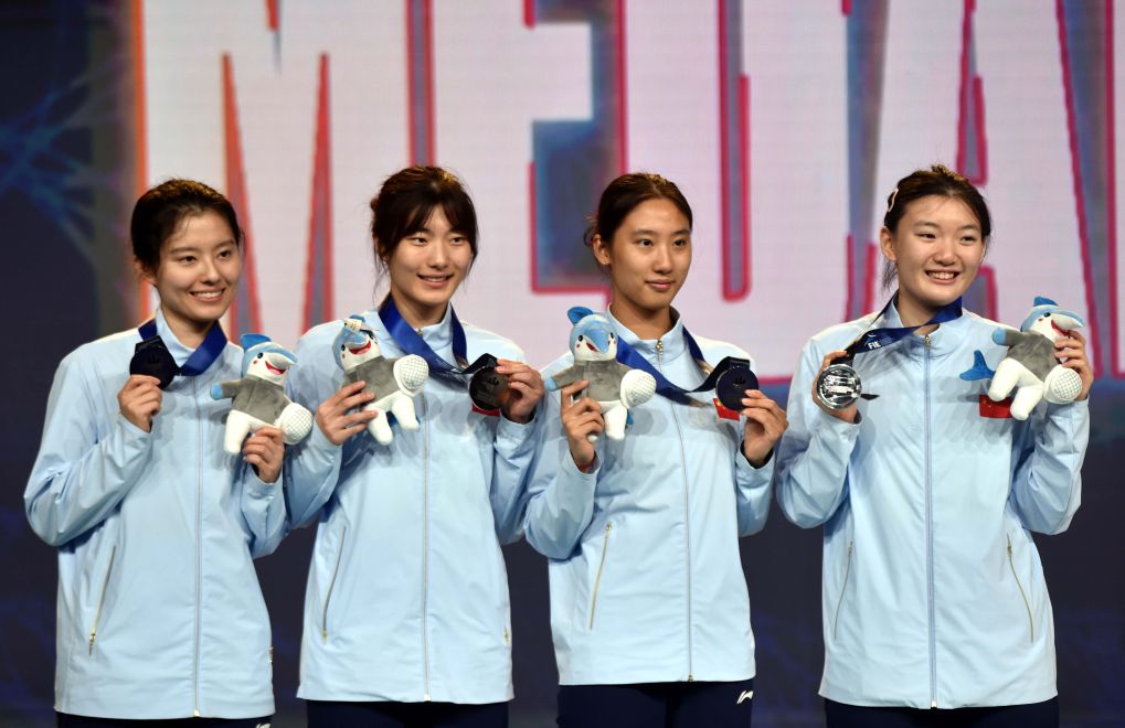 L-R: China's Zhang Xinyi, Wei Jiayi, Rao Xueyi and Pan Qimiao display their silver medals after finishing the women's team sabre final against Hungary at the Fencing World Championships in China's Hong Kong Special Administrative Region, July 29, 2026. /Xinhua

