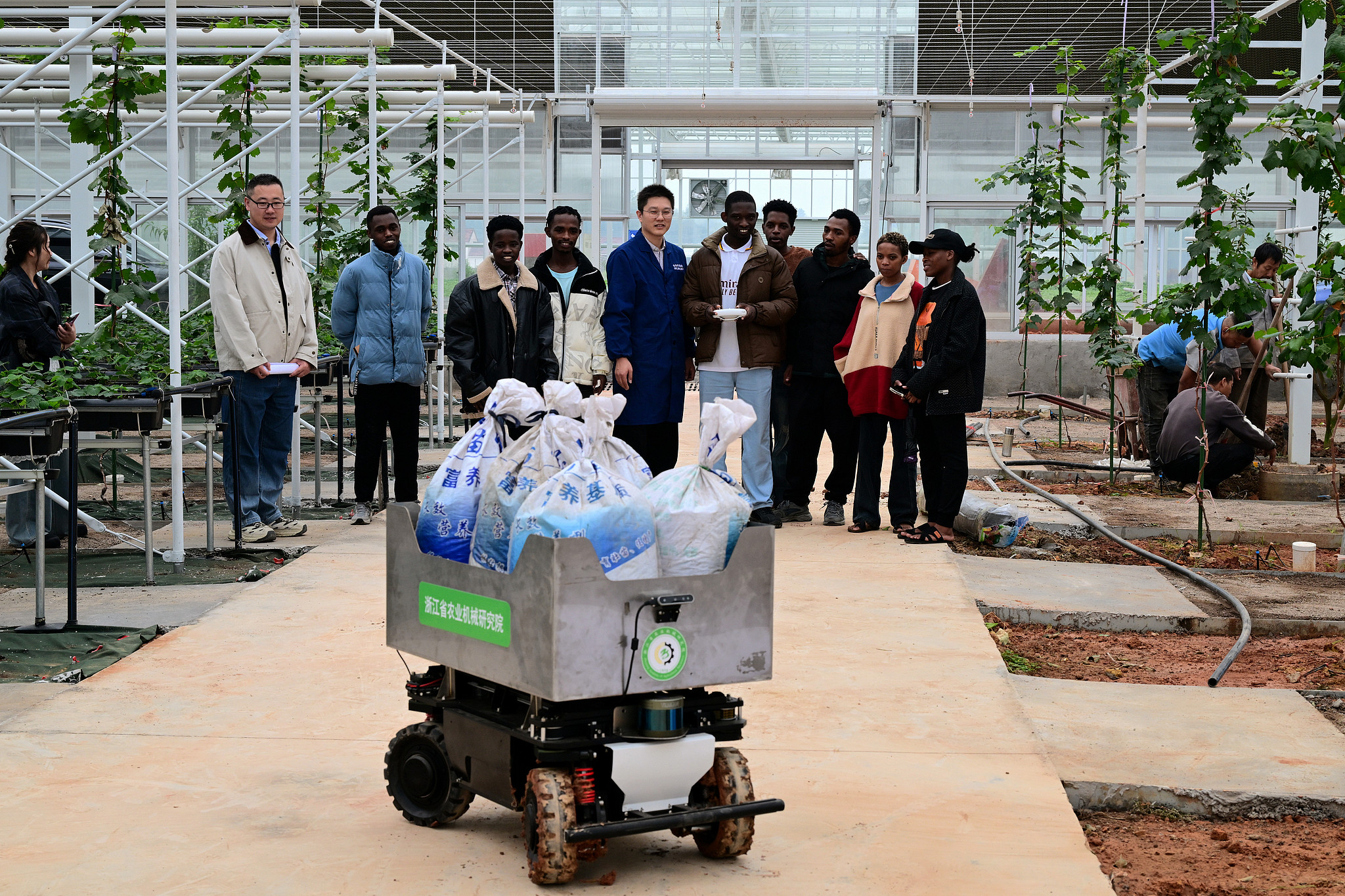 African students receive practical training in intelligent greenhouse handling robot technology at Jinhua Polytechnic, Jinhua, Zhejiang Province, east China, October 31, 2025. /CFP