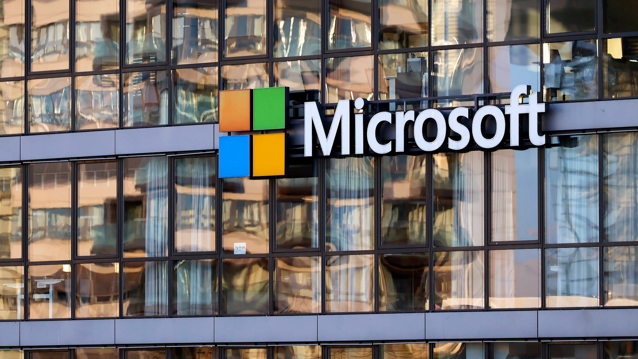 A Microsoft logo is seen outside the headquarters of Microsoft Germany GmbH in Cologne, North Rhine-Westphalia, Germany, July 28, 2026. /VCG