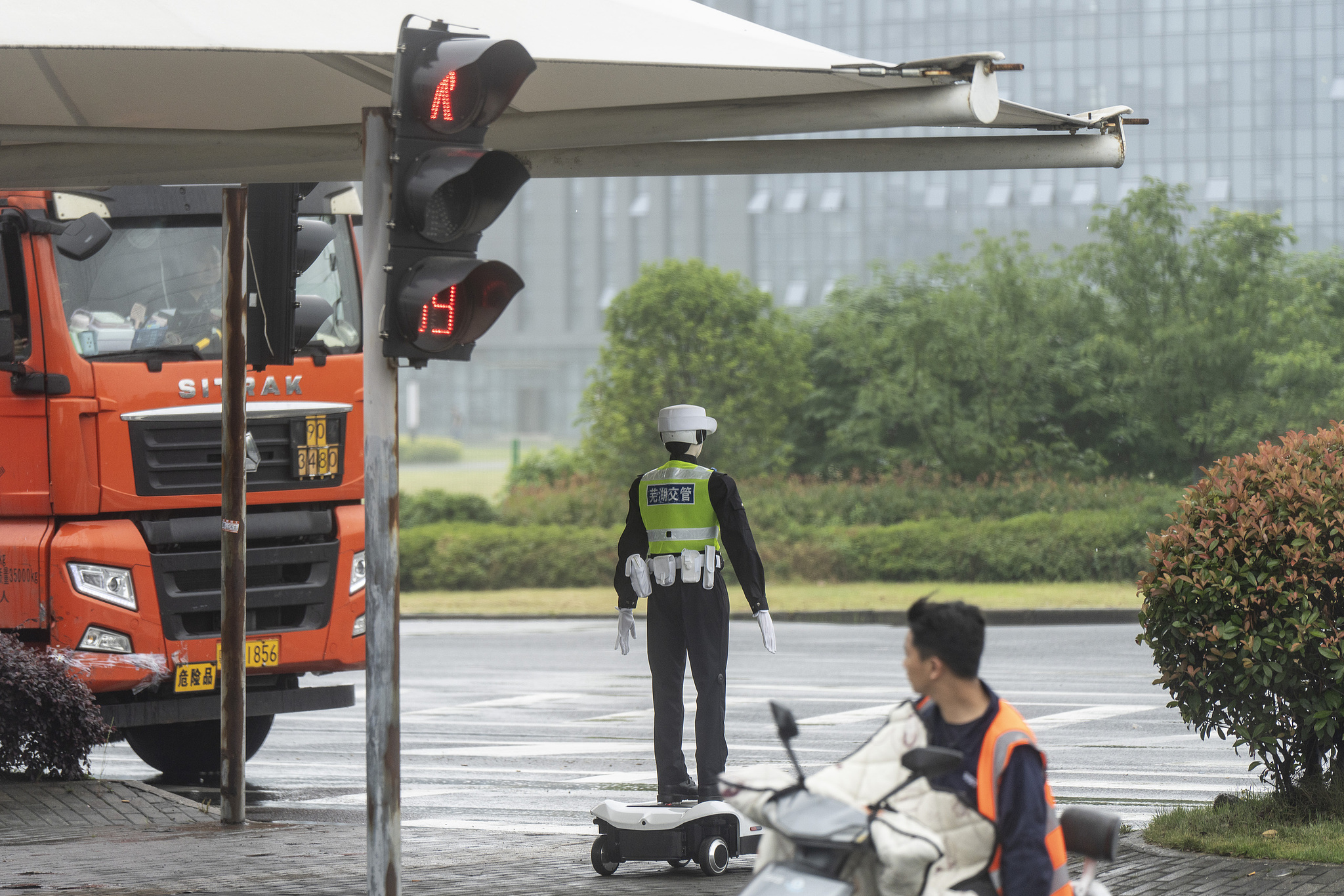 An AiMOGA traffic police robot is pictured on duty in Wuhu, east China's Anhui Province on May 20, 2026. /VCG