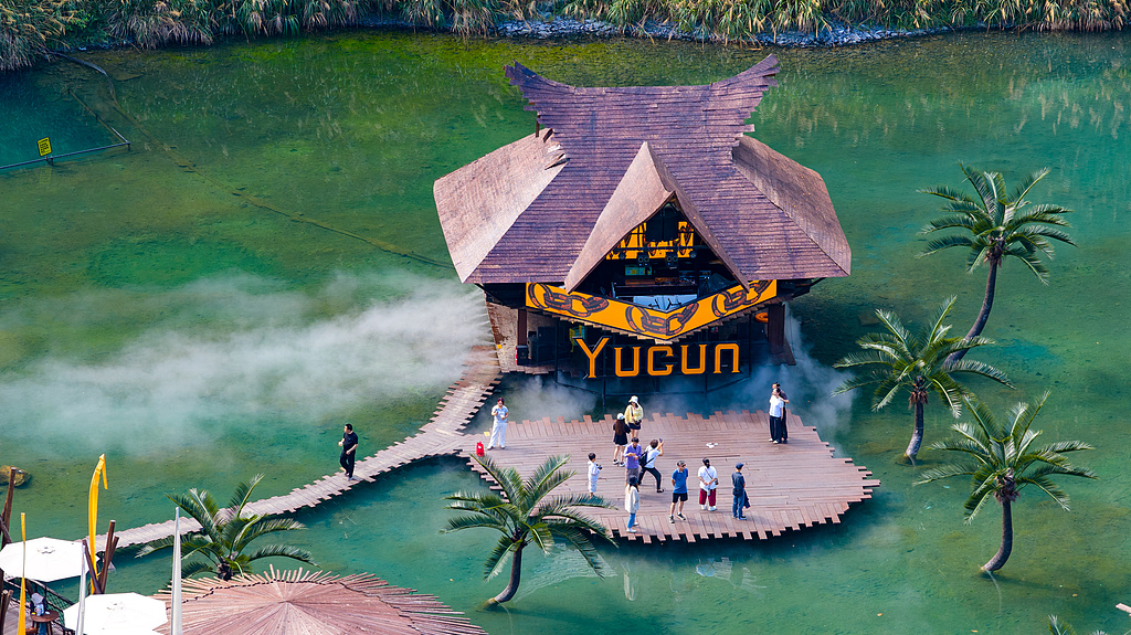 Tourists explore the Mine Waterfall Coffee attraction in Anji, Zhejiang Province, China, July 26, 2026. /VCG
