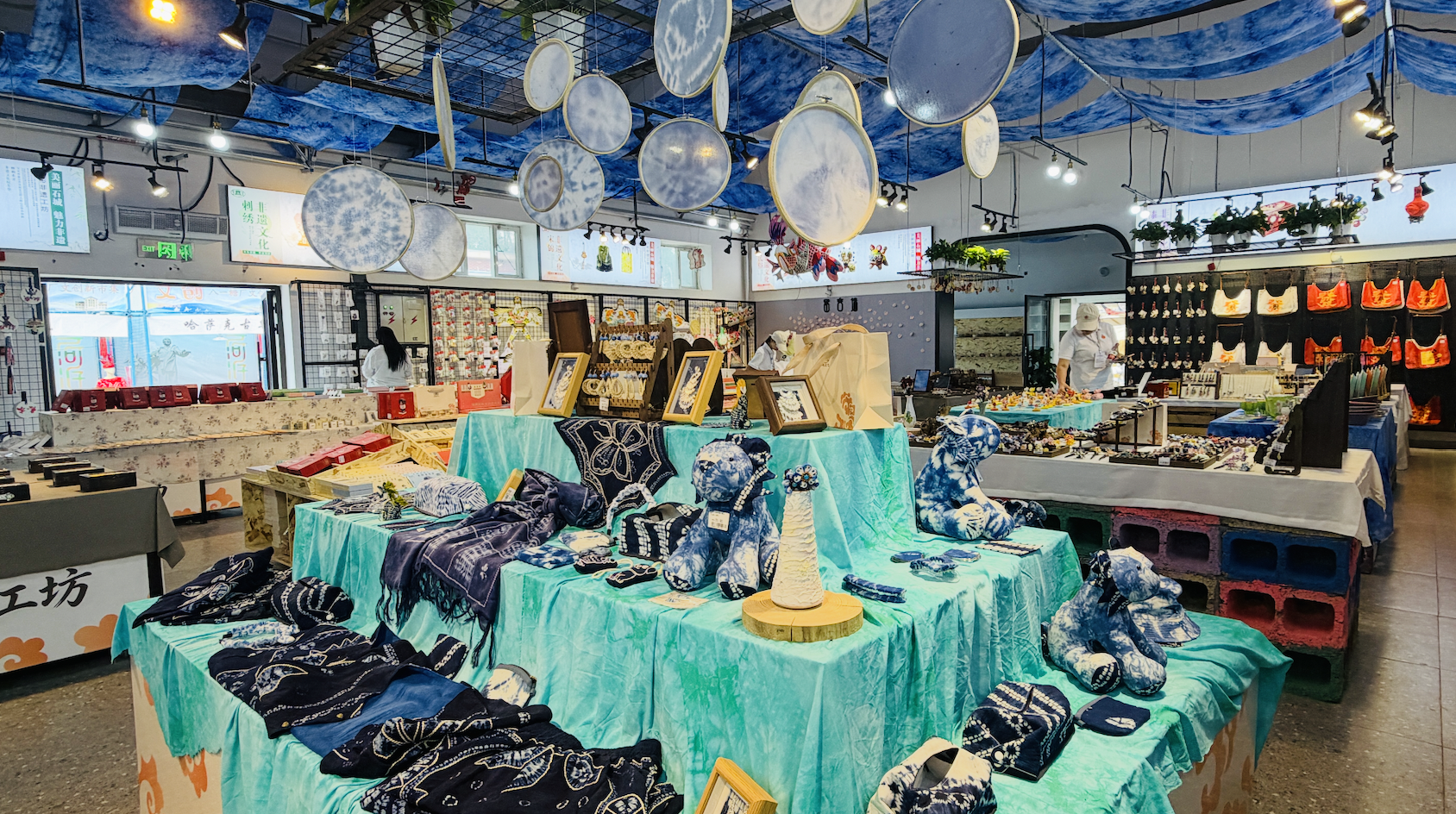 Diverse intangible cultural heritage artworks are displayed at the Bayi Sugar Factory in Shehezi, Xinjiang Uygur Autonomous Region on July 30, 2026. /CGTN