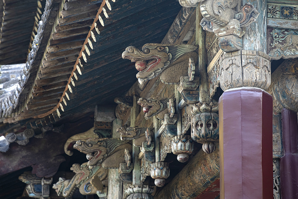 The wooden structure and sweeping tiled roof of the Shuijing Stage is seen at Jinci Temple in Taiyuan, north China's Shanxi Province. /IC