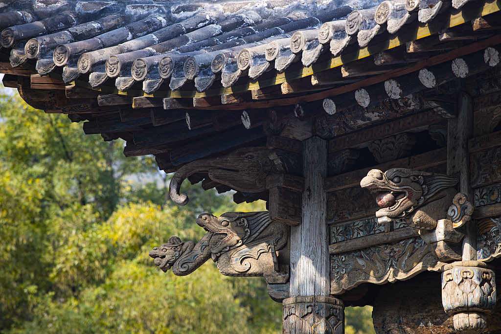The wooden structure and sweeping tiled roof of the Shuijing Stage is seen at Jinci Temple in Taiyuan, north China's Shanxi Province. /IC