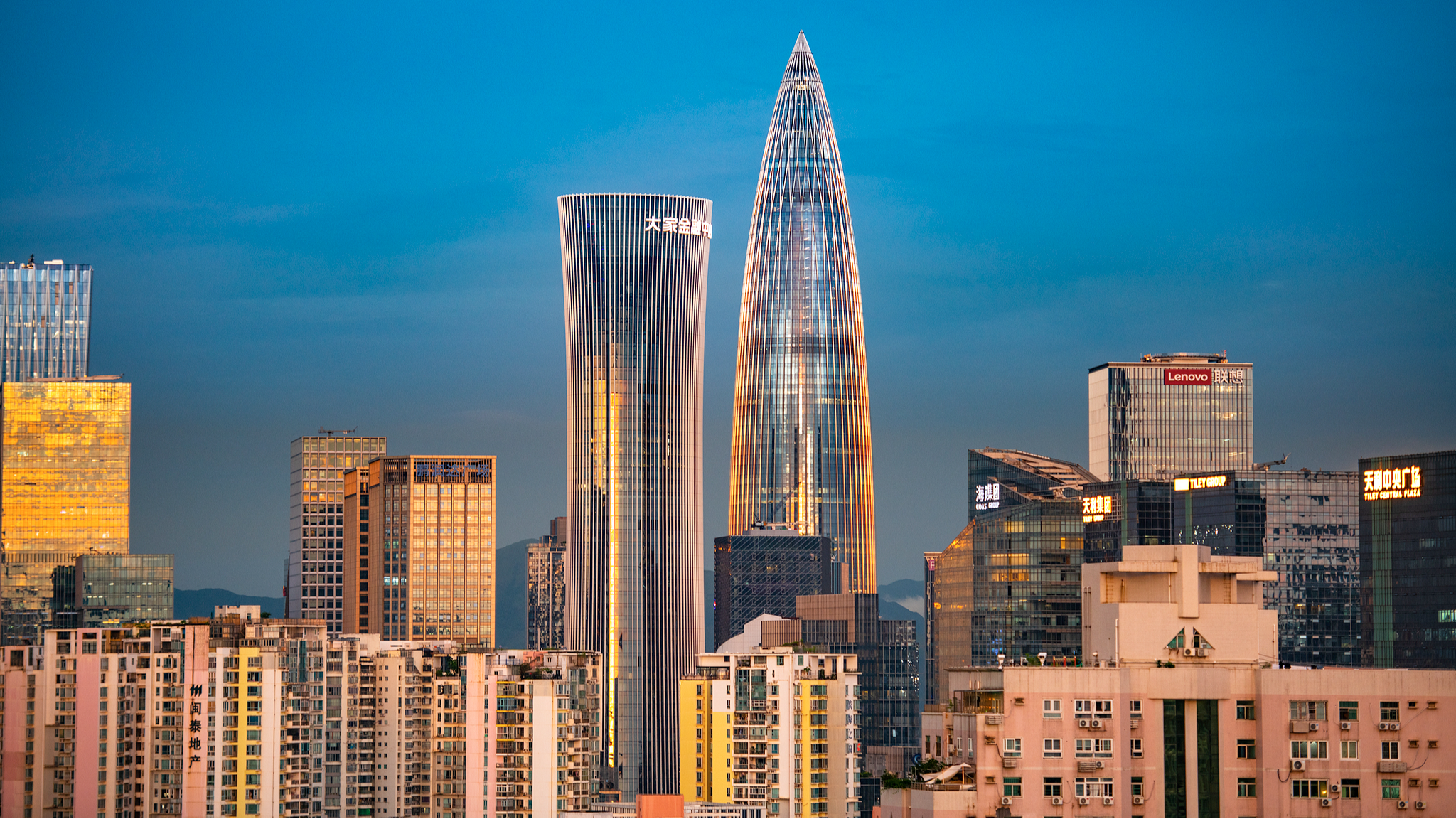 Nanshan District in Shenzhen, Guangdong Province, glows under the setting sun, July 16, 2026. /CFP