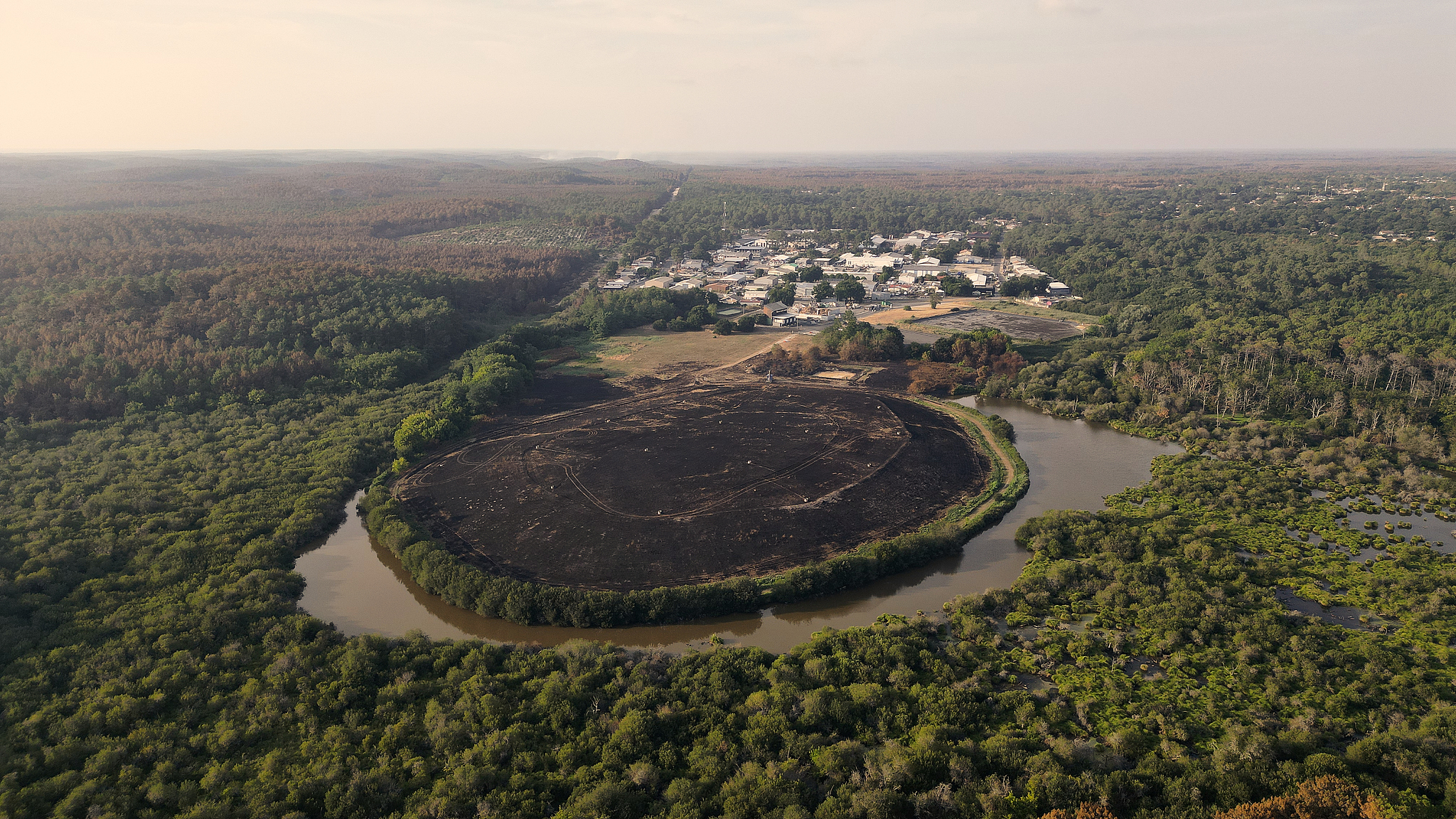 An aerial view shows land surrounded by water after a wildfire near Arcachon Bay in Claouey, 53 kilometers west of Bordeaux, France, July 30, 2026. /VCG