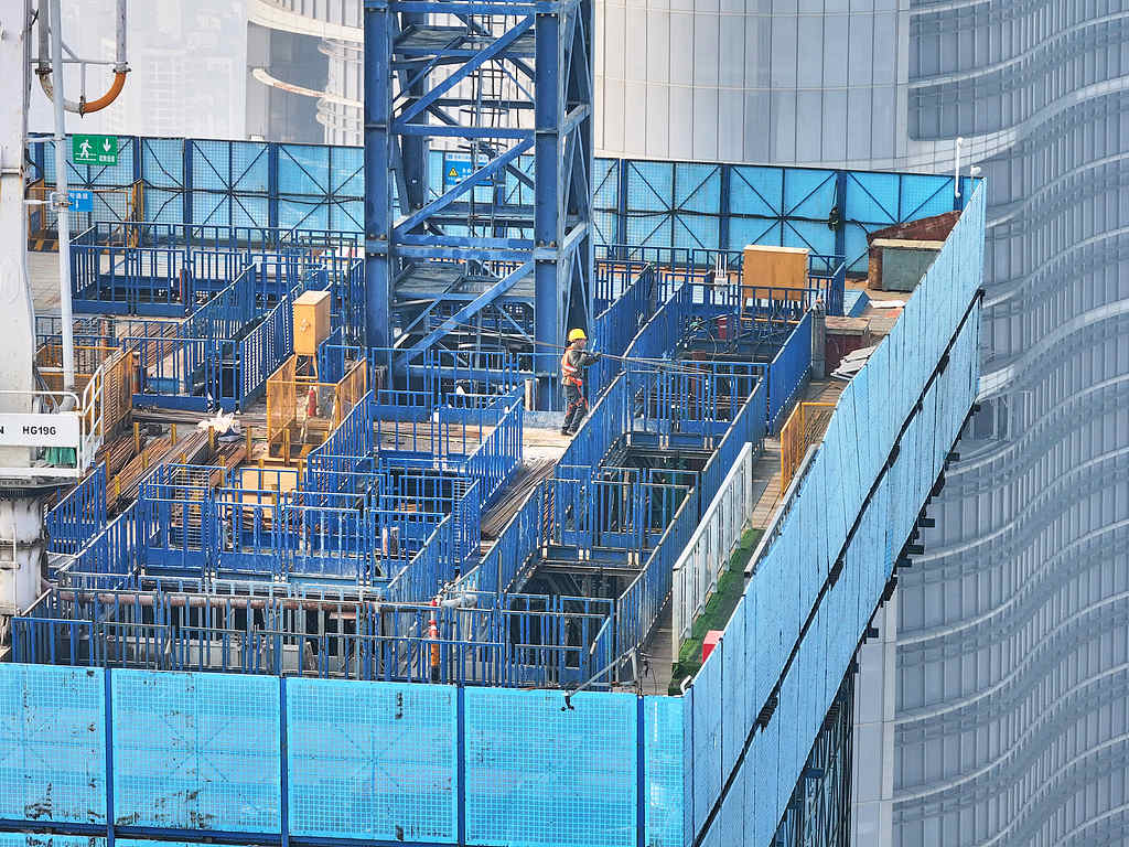 Workers operate on the 