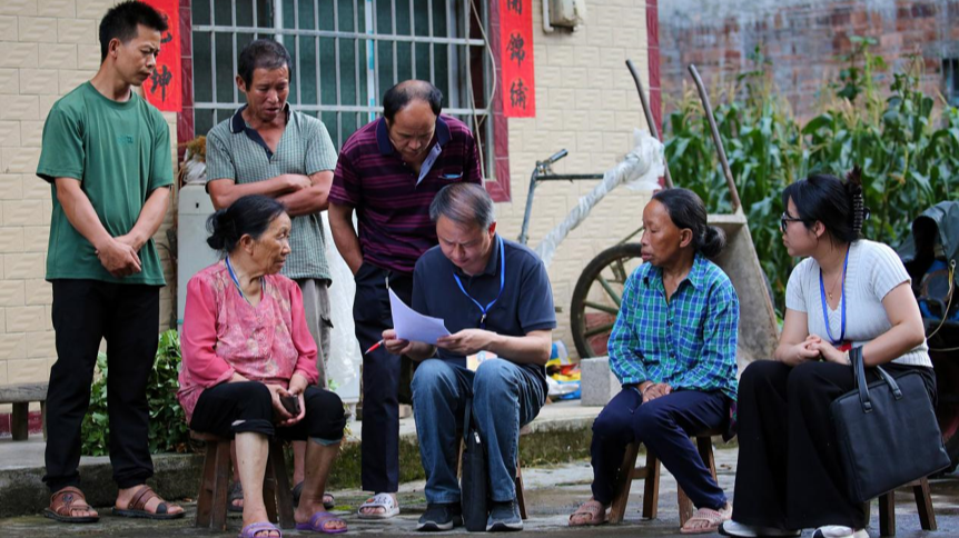 Officials visit residents to learn about local development and people's livelihoods in Yindong Village, Rongshui Miao Autonomous County, Guangxi Zhuang Autonomous Region, July 8, 2026. /Xinhua
