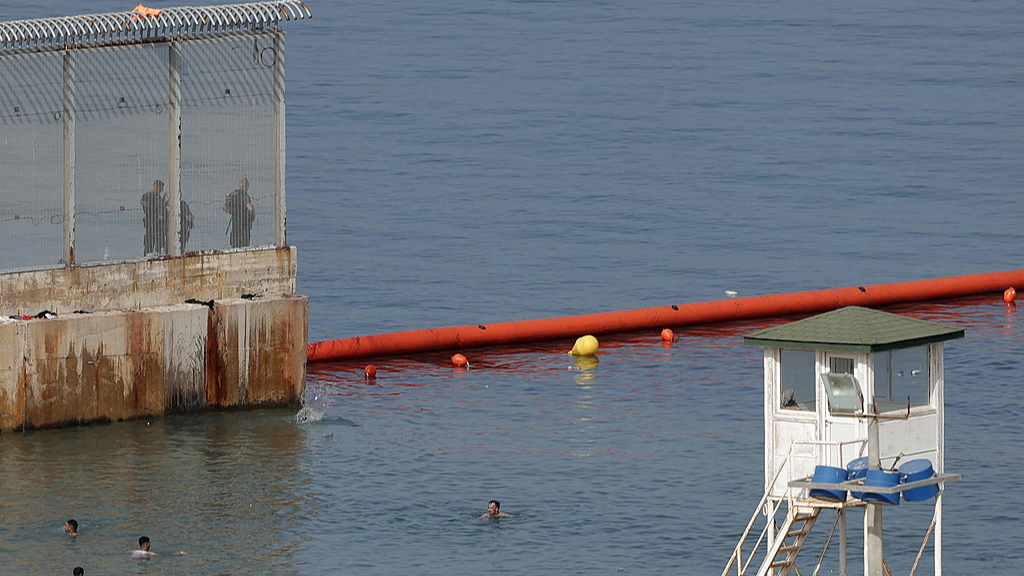 Floating barriers are installed along the maritime border between Spain's North African enclave of Ceuta and Morocco, August 1, 2026. /VCG