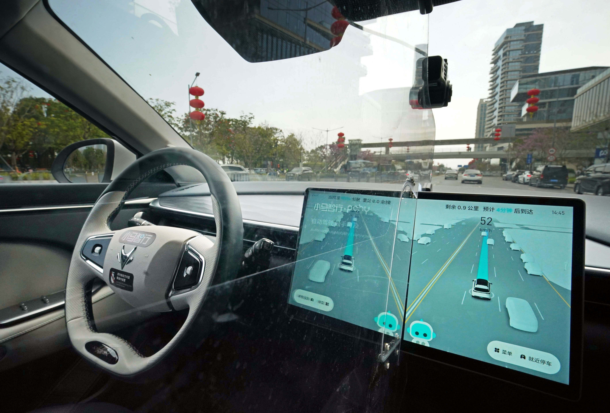 PONY AI Inc.'s autonomous car Robotaxi drives through a city with no person in the driving seat, Shenzhen, Guangdong Province, China, February 12, 2026. /VCG