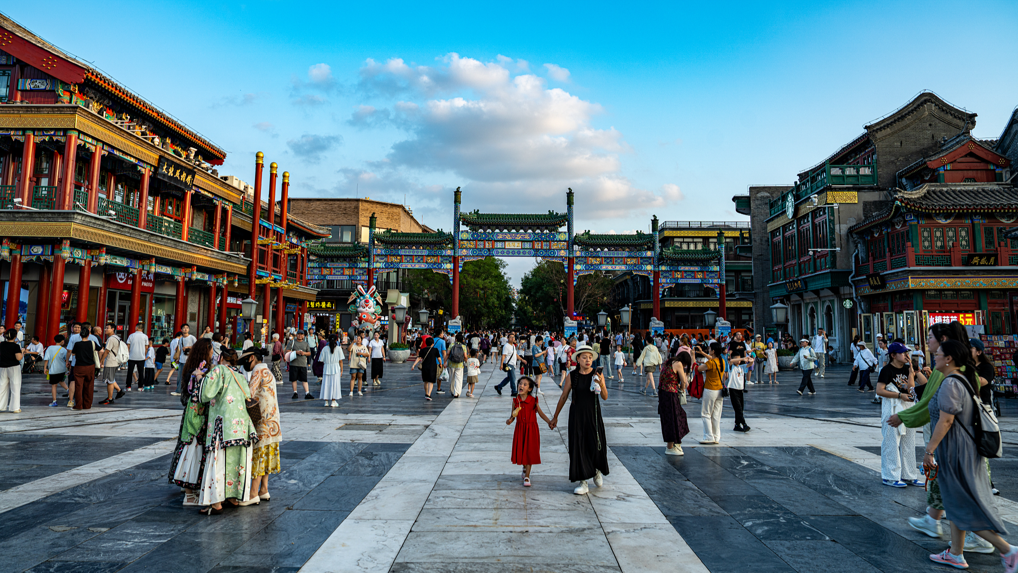 Tourists visit Qianmen Street in Beijing, China, July 30, 2026. /VCG