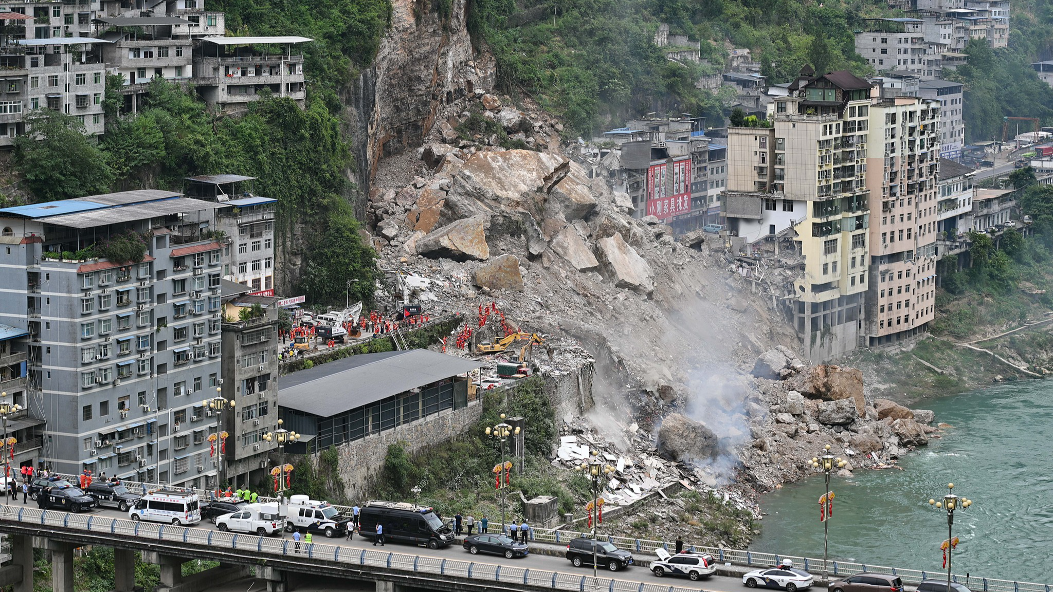 Rescuers work at the site of the mountain collapse in Pengshui Miao and Tujia Autonomous County, southwest China's Chongqing Municipality, July 17, 2026. /VCG