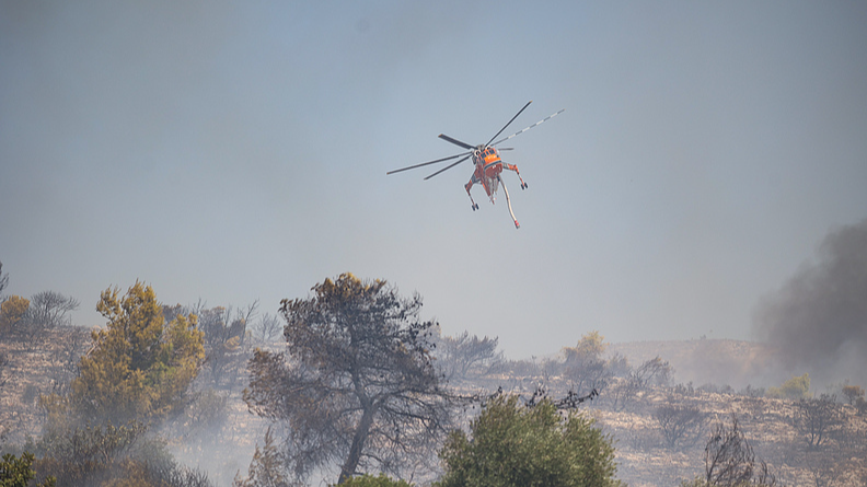 Live: Firefighters battle raging wildfires across Greece