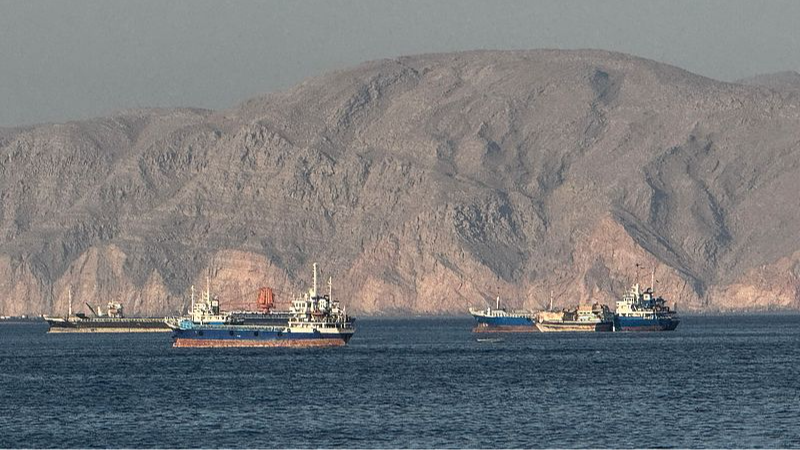 Vessels are seen anchored in the Strait of Hormuz, off the port city of Khasab on Oman's northern Musandam Peninsula, May 17, 2026. /VCG