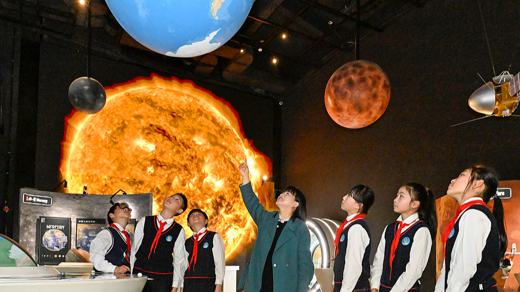 Primary school students learn about deep-space science at the Deep Space Exploration Science Popularization Art Museum in Hefei, Anhui Province, China, March 20, 2026. /VCG