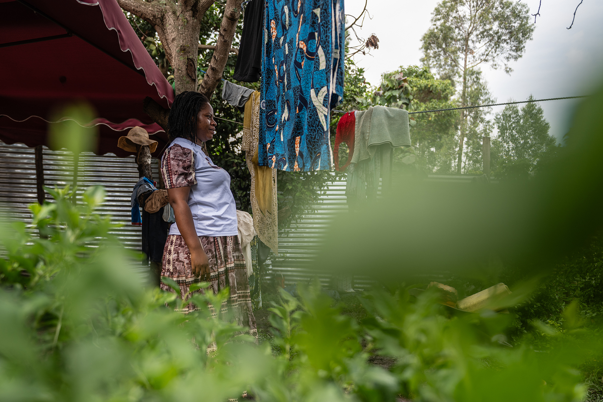 A 26 year-old woman who is four months pregnant and a mother of four, who stopped going for prenatal checkups shortly after the current Ebola outbreak, stands outside her house in Bunia, northeastern DRC, June 16, 2026. /CFP